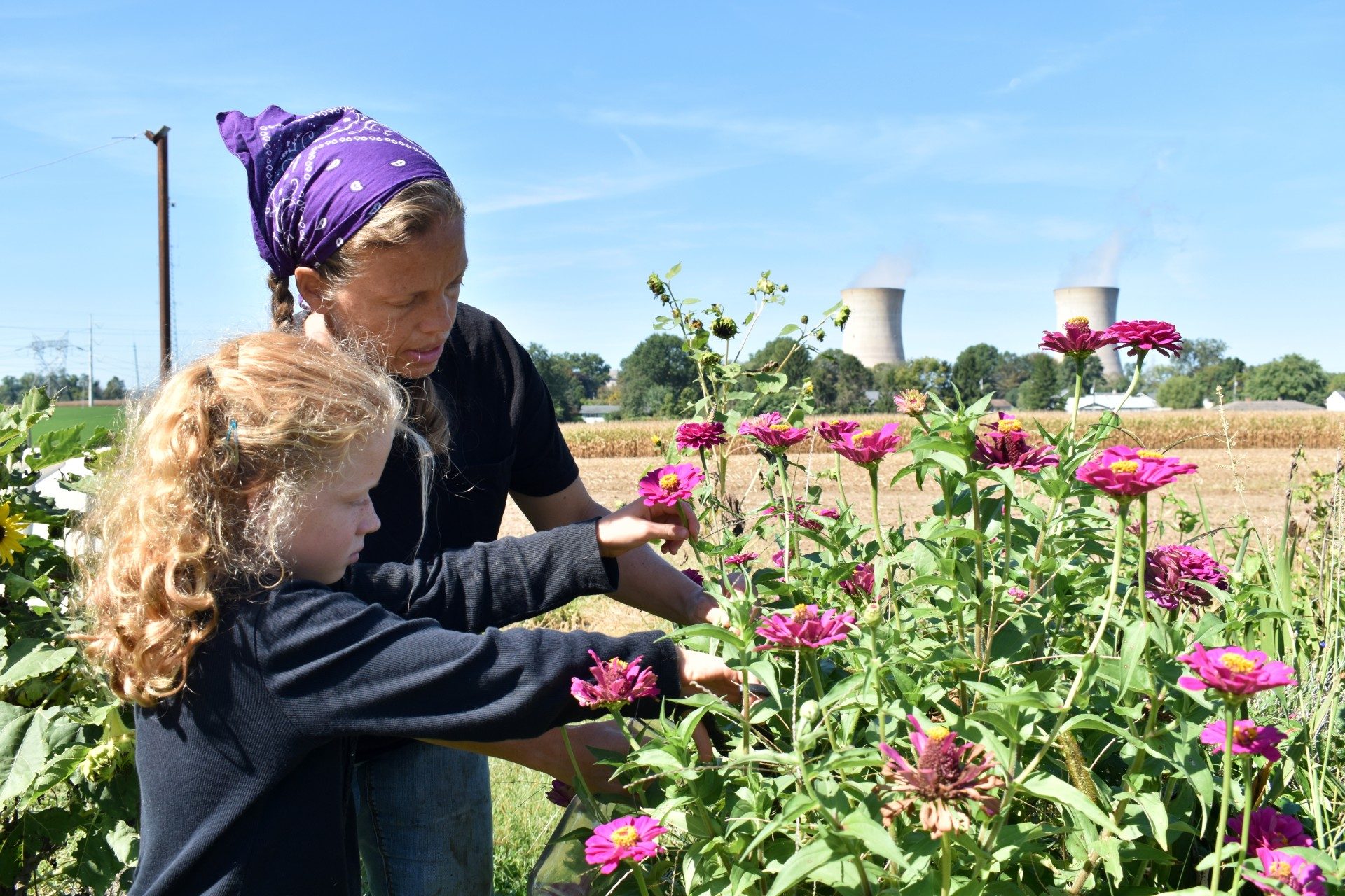 Kendra Nissley, shown with her daughter Mikayla, has spent the last 12 years running a dairy farm across the river from the plant in Londonderry Township.