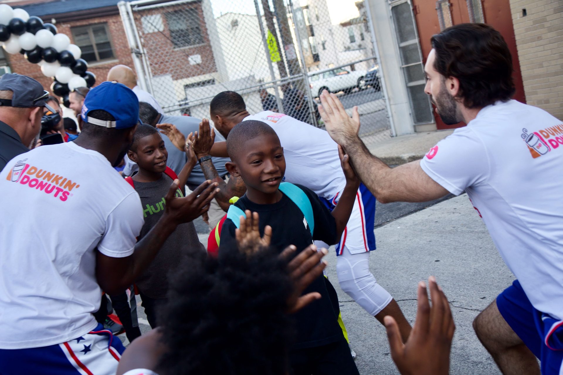 Robert Morris Elementary School students are greeted with high fives on the first day of school.