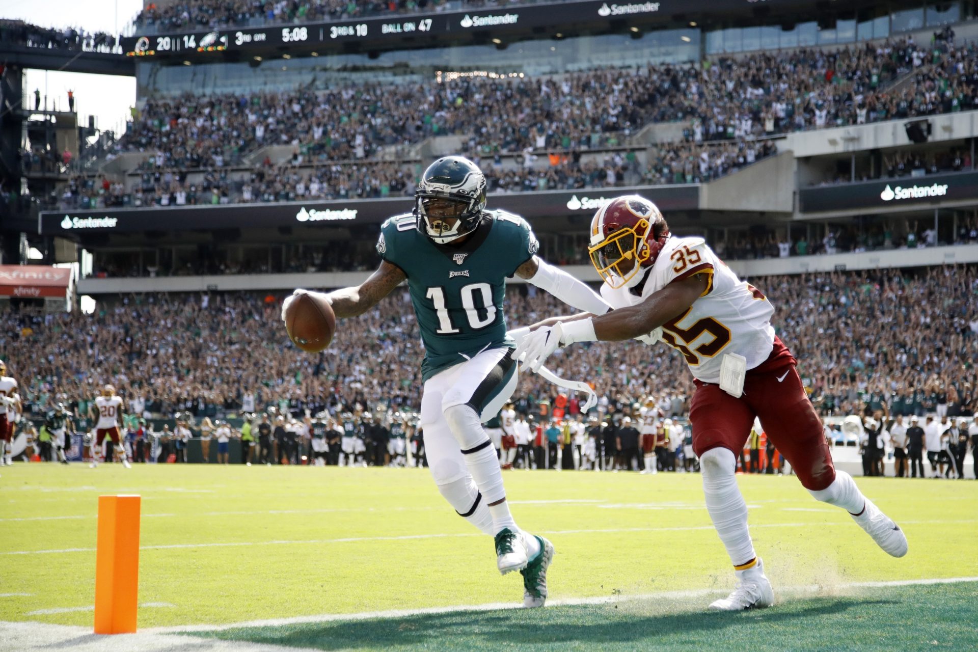 Philadelphia Eagles' DeSean Jackson, left, scores a touchdown against Washington Redskins' Montae Nicholson during the second half of an NFL football game, Sunday, Sept. 8, 2019, in Philadelphia.