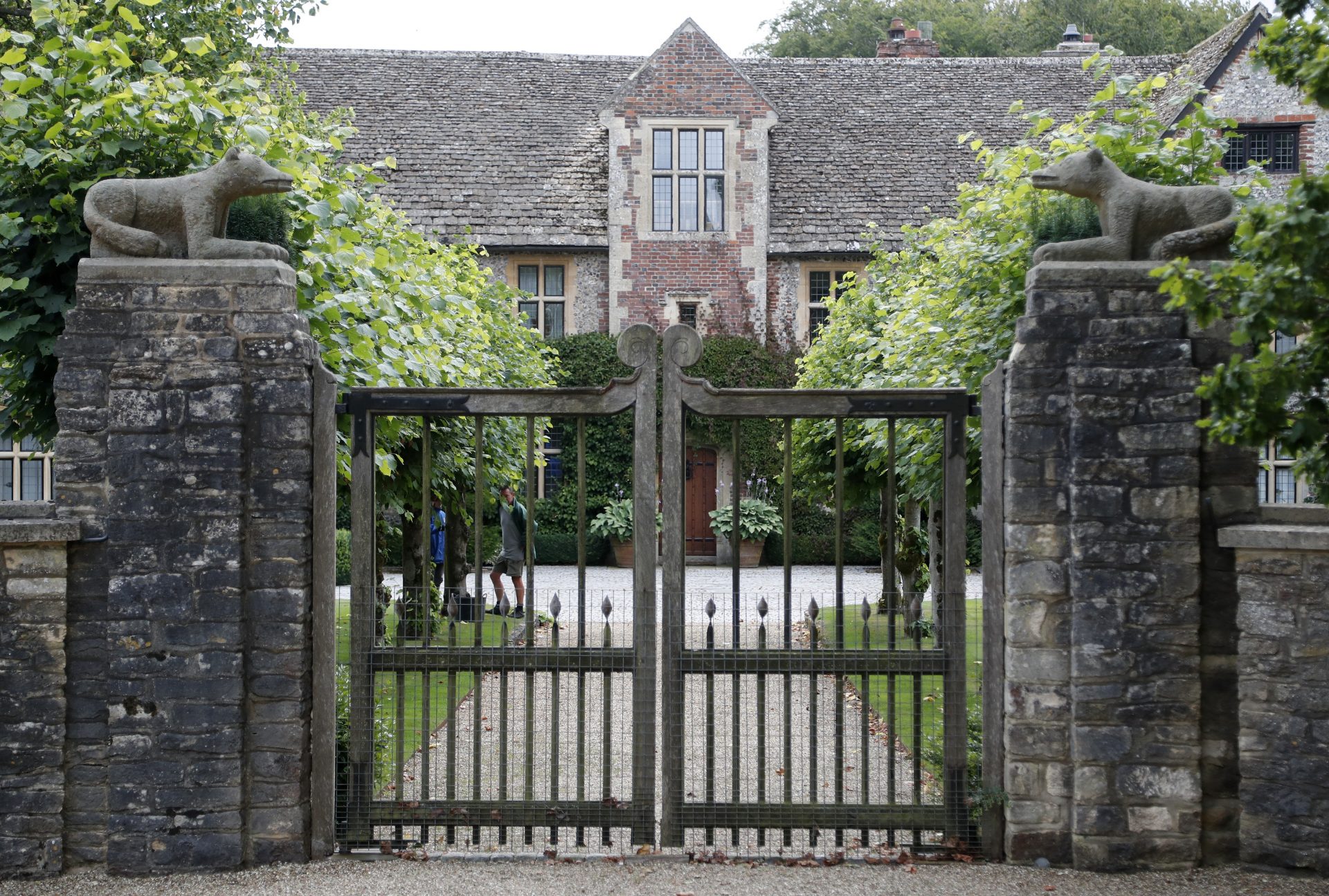 A gate protects the entrance of the Rooksnest estate near Lambourn, England, Tuesday, Aug. 6, 2019. The manor is the domain of Theresa Sackler, widow of one of Purdue Pharma’s founders and, until 2018, a member of the company’s board of directors. A complex web of companies and trusts are controlled by the family, and an examination reveals links between far-flung holdings, far removed from the opioid manufacturer’s headquarters in Stamford, Conn.