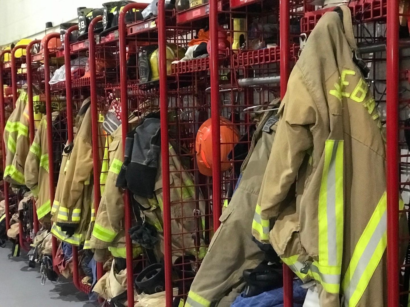 Bunker gear hangs in the garage of the fire house in Mt. Lebanon. The township has a combination fire house — a mix of volunteer and career firefighters.