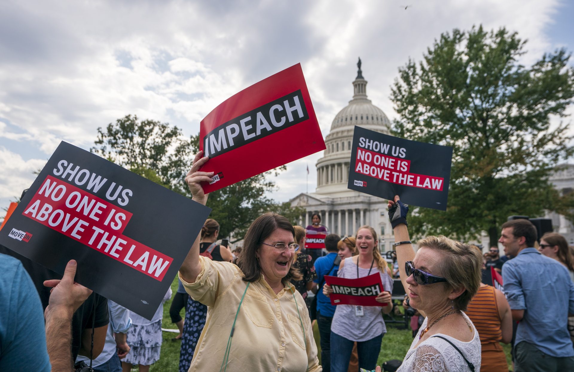 Activists rally for the impeachment of President Donald Trump, at the Capitol in Washington, Thursday, Sept. 26, 2019. Speaker of the House Nancy Pelosi, D-Calif., committed Tuesday to launching a formal impeachment inquiry against Trump.