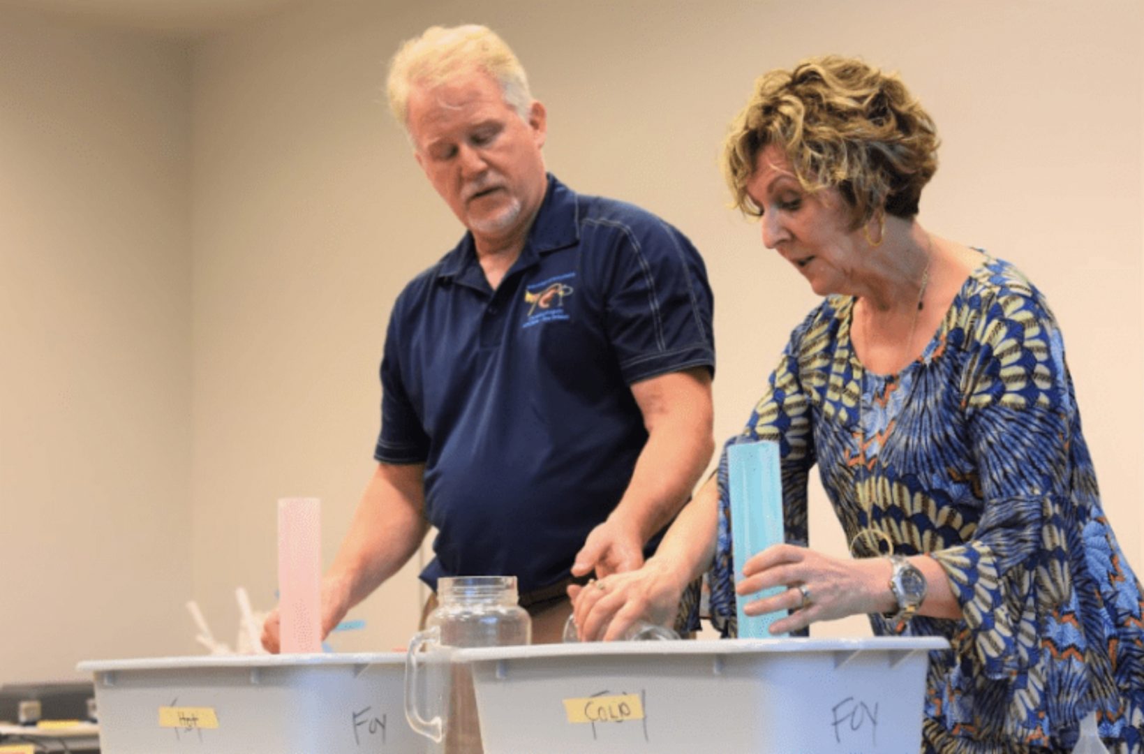 Science teacher Leigh Foy (right) couldn't find climate education materials so she and her husband, chemistry professor Greg Foy (left) designed their own.  