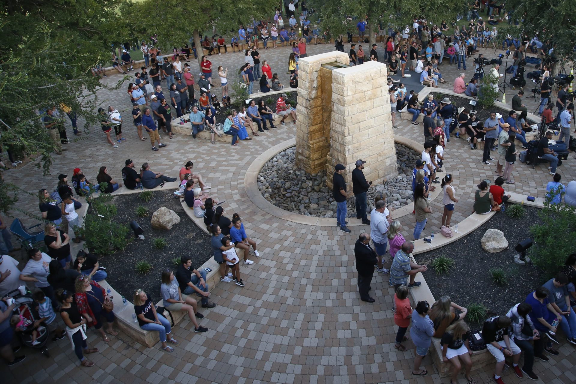 People attend a memorial service for the victims of a shooting spree the day before, Sunday, Sept. 1, 2019, in Odessa, Texas.