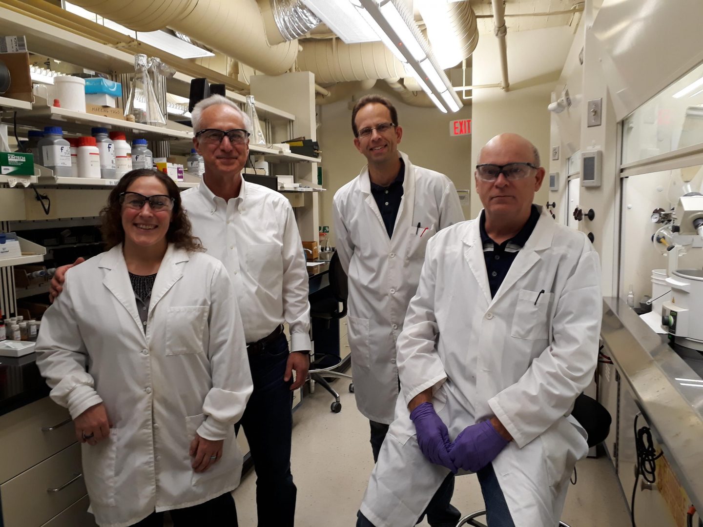 Knopp CEO Mike Bozik (second from left) stands in the Knopp lab with scientists Kelly Picchione (left,) Dave Mareska (second from right) and Chuck Flentge.