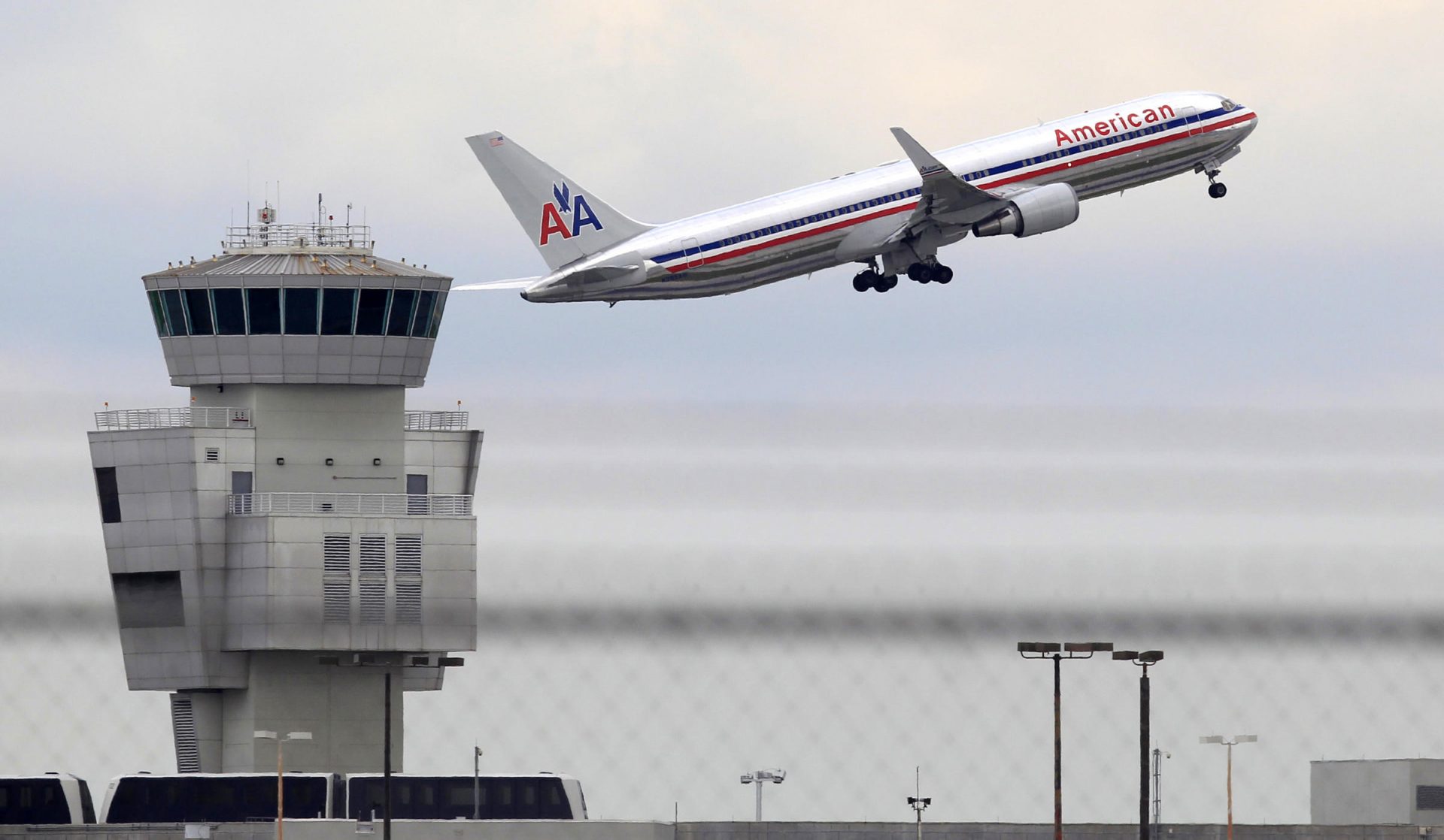 In this Friday, Oct. 14, 2011 photo, an American Airlines Boeing 767 takes off from Miami International Airport, in Miami. Even higher fares couldn't pull American Airlines out of its financial nosedive. American's parent, AMR Corp., said Wednesday, Oct. 14, 2011, that it lost $162 million in the third quarter, as fuel spending jumped 40 percent, wiping out higher revenue from fare increases and passenger fees.