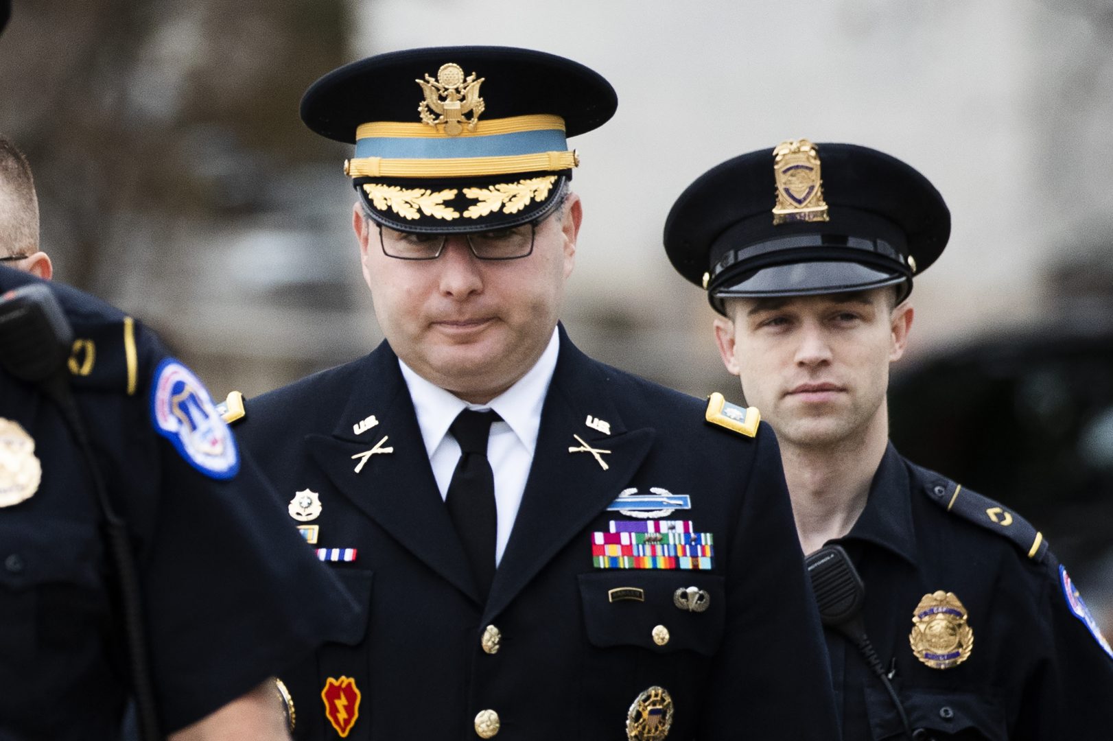 Army Lieutenant Colonel Alexander Vindman, a military officer at the National Security Council, center, arrives on Capitol Hill in Washington, Tuesday, Oct. 29, 2019, to appear before a House Committee on Foreign Affairs, Permanent Select Committee on Intelligence, and Committee on Oversight and Reform joint interview with the transcript to be part of the impeachment inquiry into President Donald Trump.