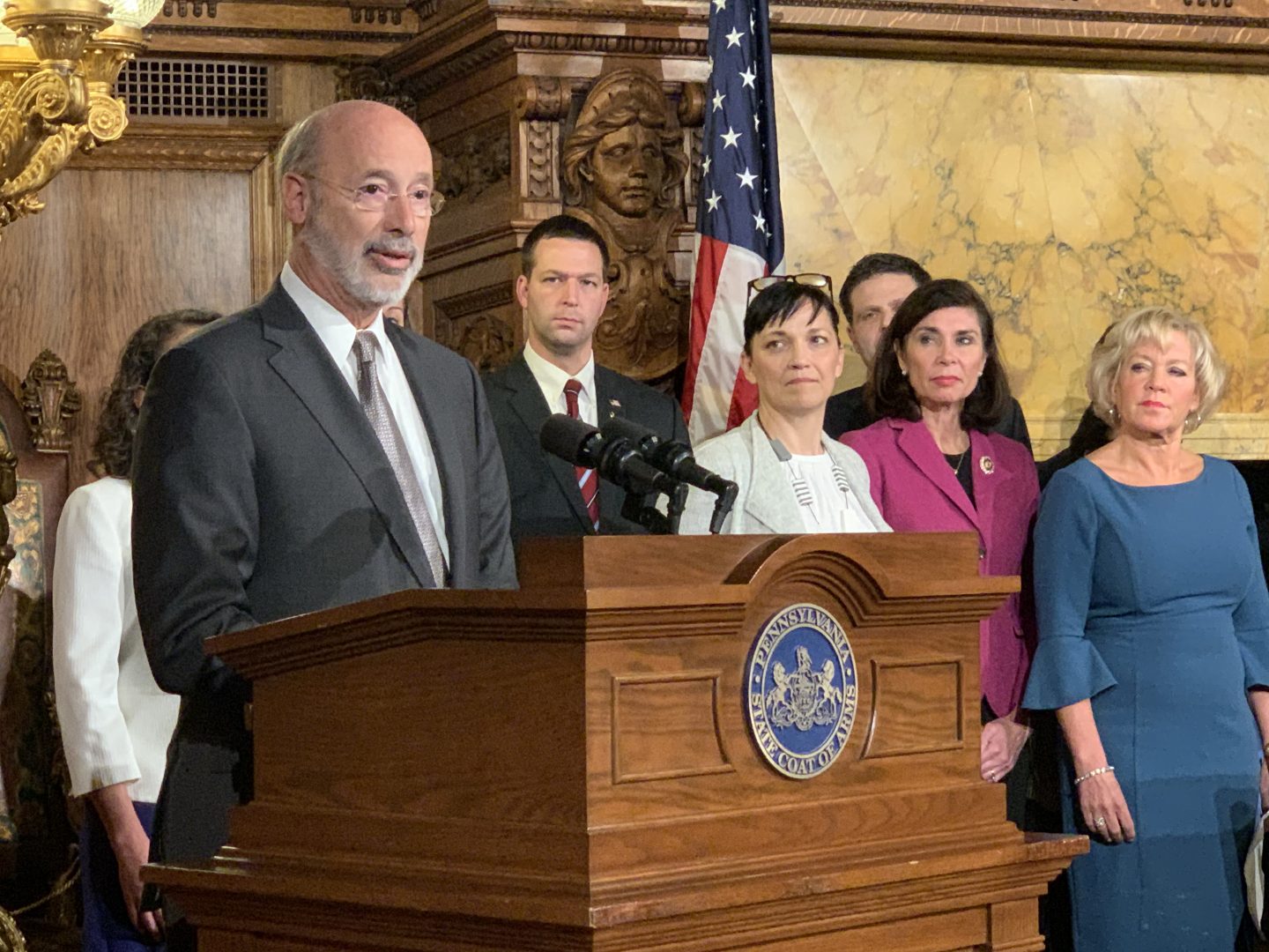 Gov. Tom Wolf signs election reforms law Act 77 into effect Thursday during a ceremony alongside supporters including sponsor state Sen. Lisa Boscola, D-Lehigh/Northampton (far right). 