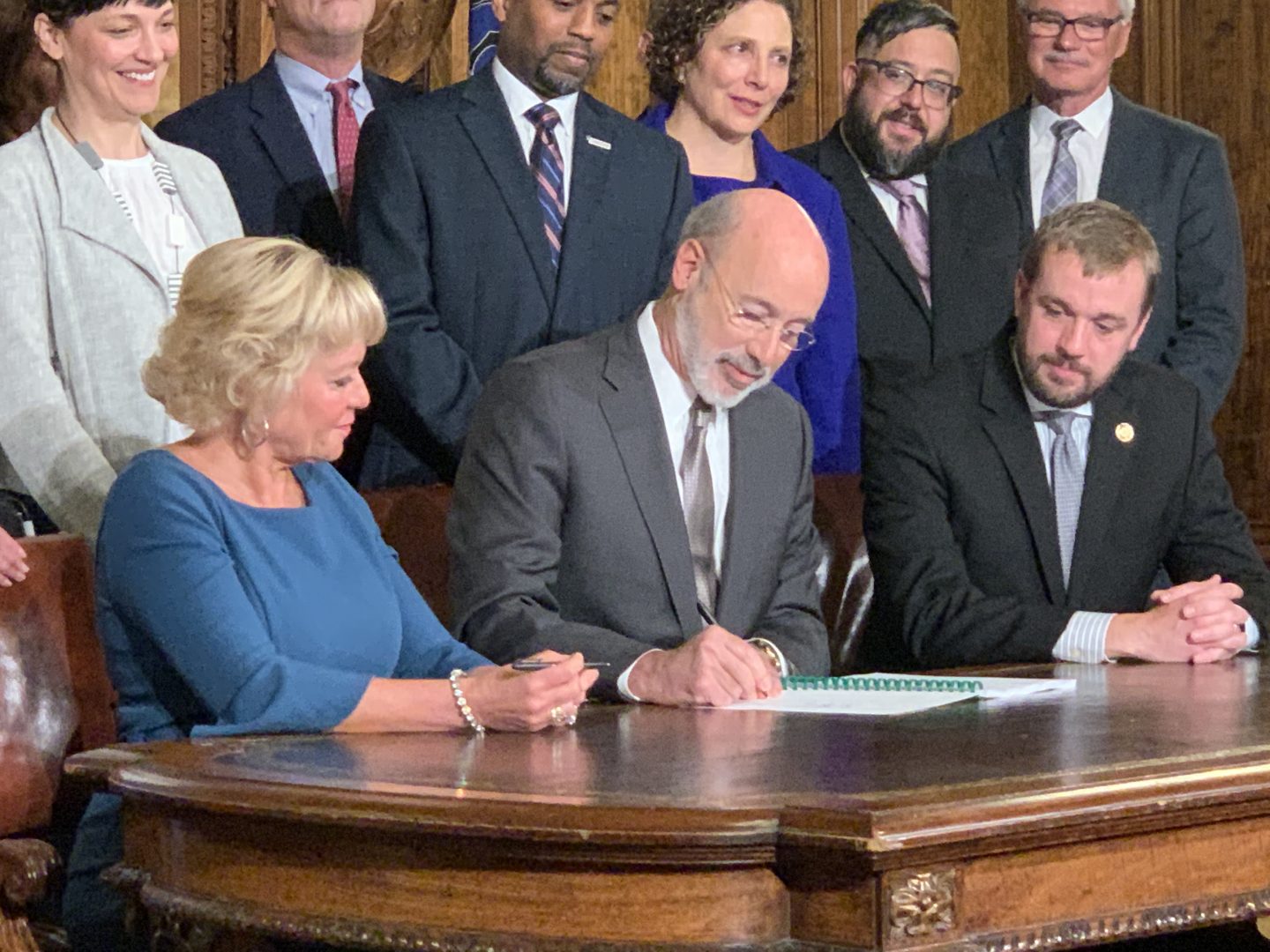 Gov. Tom Wolf signs election reforms law Act 77 into effect Thursday flanked by sponsor state Sen. Lisa Boscola, D-Lehigh/Northampton, and House Majority Leader Bryan Cuter, R-Lancaster. 