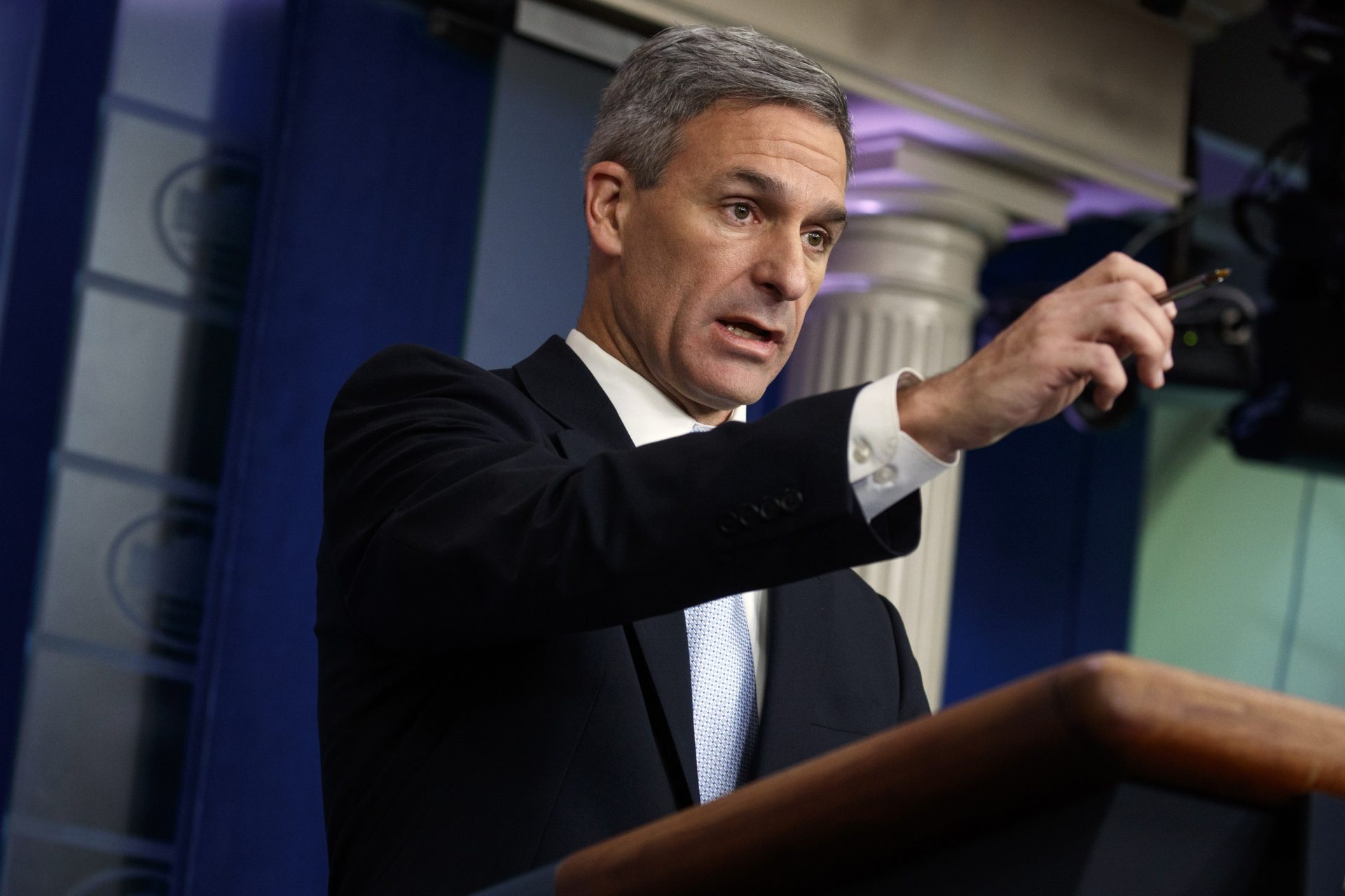 FILE PHOTO: In this Aug. 12, 2019 file photo Acting Director of United States Citizenship and Immigration Services Ken Cuccinelli, speaks during a briefing at the White House in Washington. The Trump administration has unveiled new rules that will make it harder for children of some immigrants serving in the military to obtain citizenship. U.S. Citizenship and Immigration Services released updated guidance Wednesday, Aug. 28, 2019, that appears to mostly affect non-citizen service members.