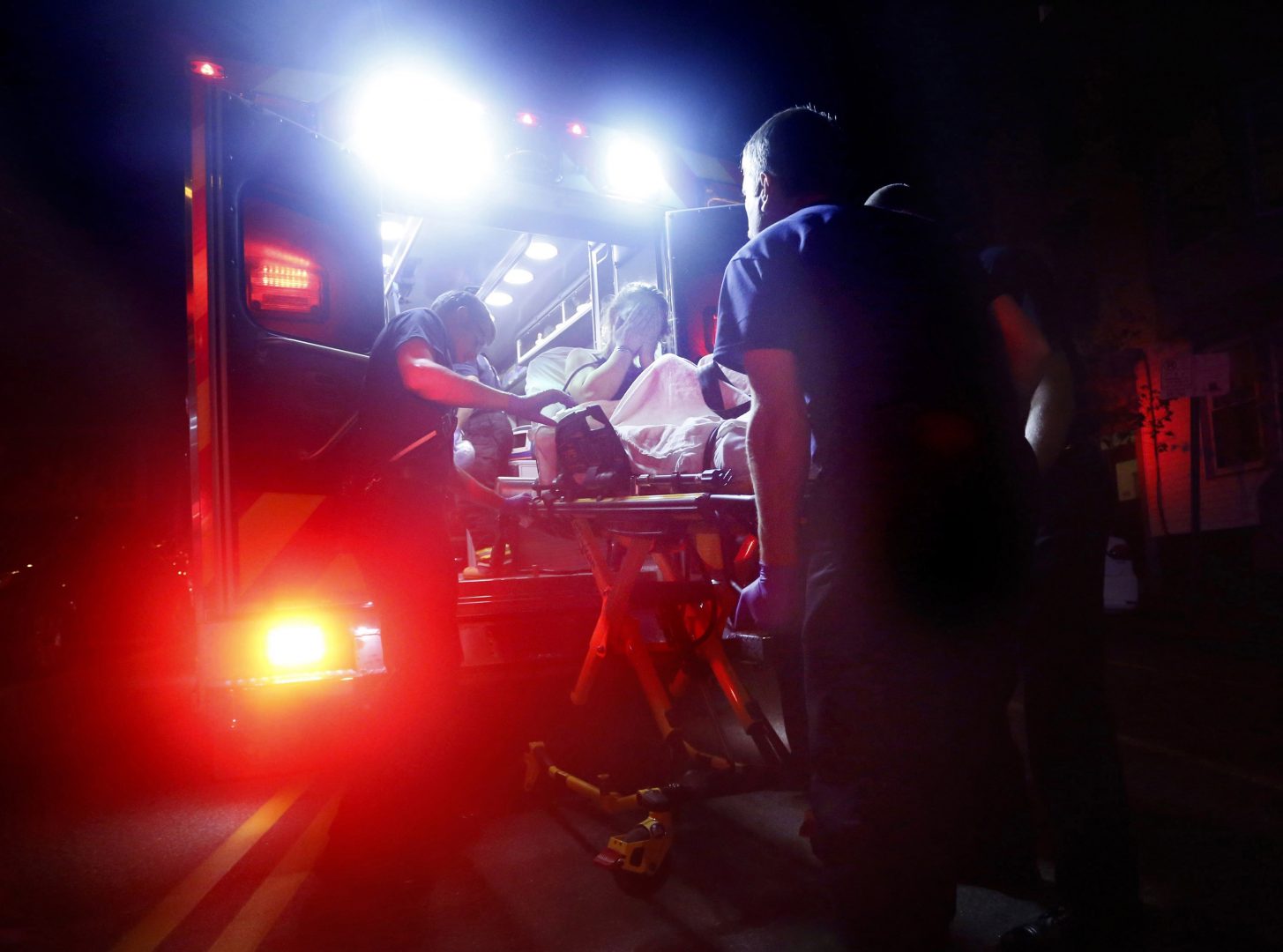 Paramedics in Portland, Maine, respond to a call for a heroin overdose. A new report estimates some $60 billion was spent on health care related to opioid addiction in 2018.
