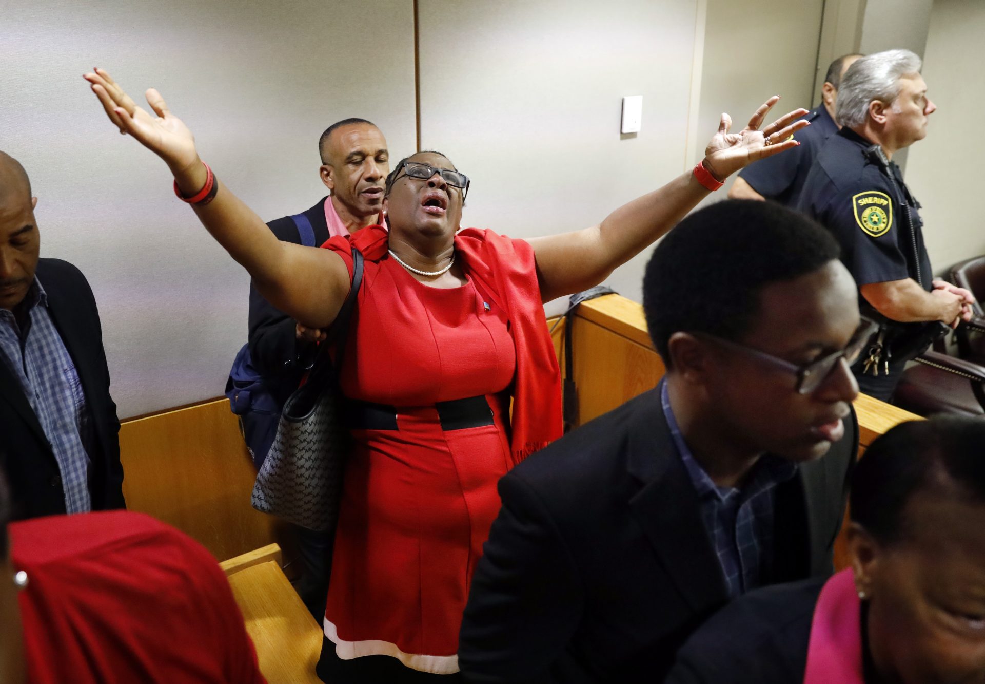 Botham Jean's mother, Allison Jean, rejoices in the courtroom after fired Dallas police Officer Amber Guyger was found guilty of murder, Tuesday, Oct. 1, 2019, in Dallas. Guyger shot and killed Botham Jean, an unarmed 26-year-old neighbor in his own apartment last year. She told police she thought his apartment was her own and that he was an intruder.