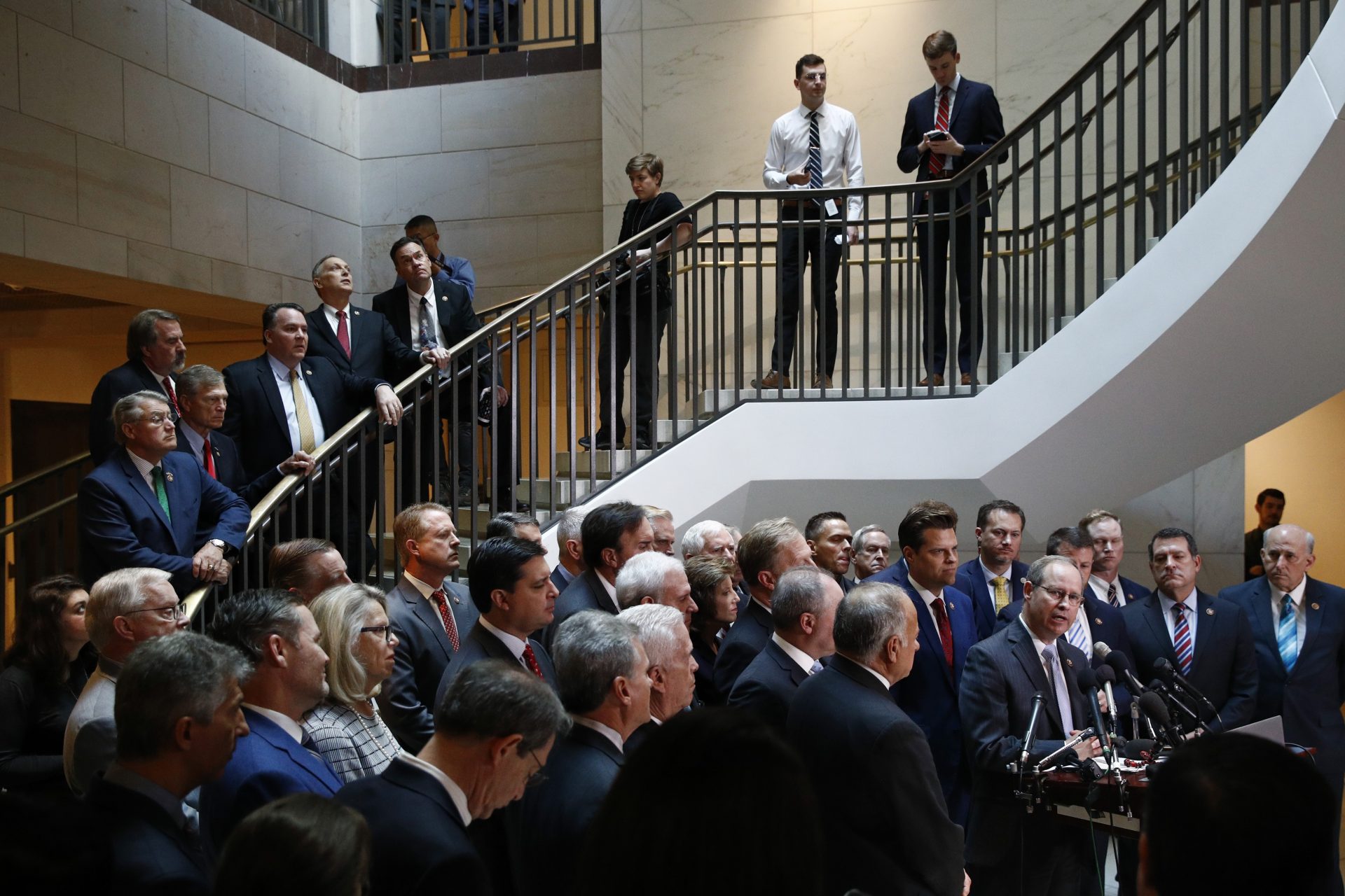 House Republicans gather for a news conference after Deputy Assistant Secretary of Defense Laura Cooper arrived for a closed door meeting to testify as part of the House impeachment inquiry into President Donald Trump, Wednesday, Oct. 23, 2019, on Capitol Hill in Washington.
