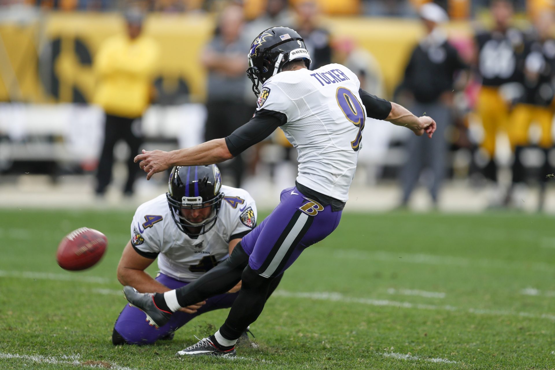Baltimore Ravens kicker Justin Tucker (9) kicks a field goal as Sam Koch (4) holds to defeat the Pittsburgh Steelers in overtime of an NFL football game, Sunday, Oct. 6, 2019, in Pittsburgh. The Ravens won 26-23.