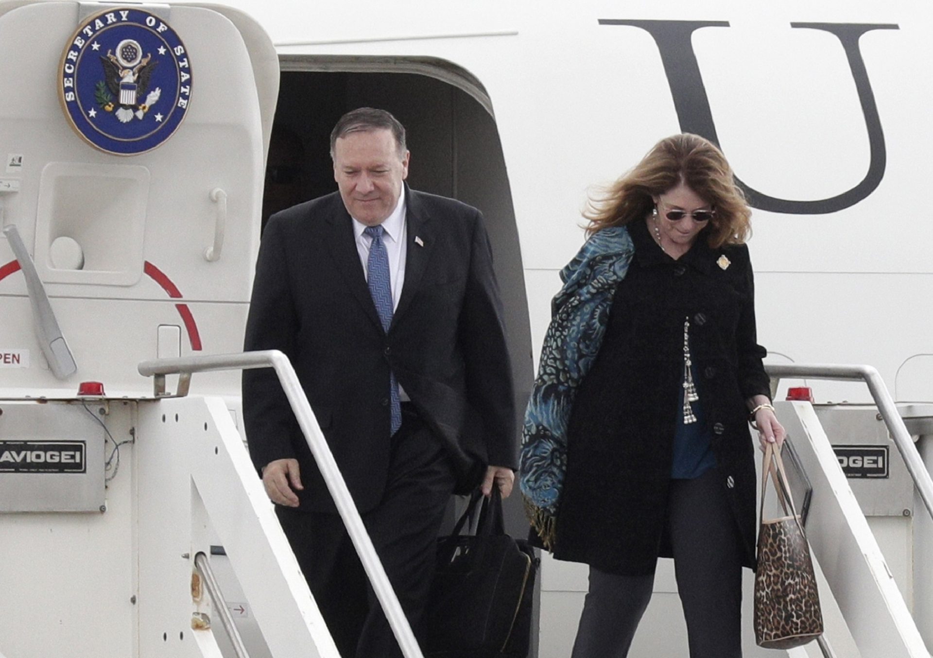 United States Secretary of State Mike Pompeo and his wife Susan Pompeo walk out of the plane upon arriving at Ciampino military airport, in Rome, Tuesday, Oct. 1, 2019. Pompeo is in Italy for a 3-day trip.