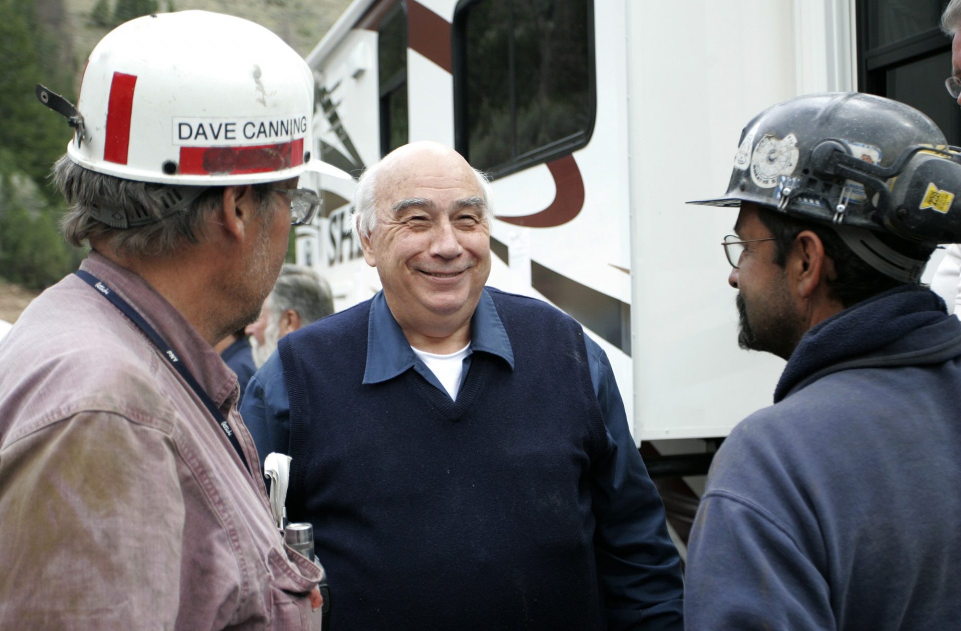 FILE PHOTO: In an Aug, 26, 2007 file photo, Robert Murray, center, chief executive of Murray Energy Corp., smiles while talking to Dave Canning, left, and Mike Glassom, right, two miners in charge of drilling bore holes into the Crandall Canyon M before a news conference northwest of Huntington, Utah.