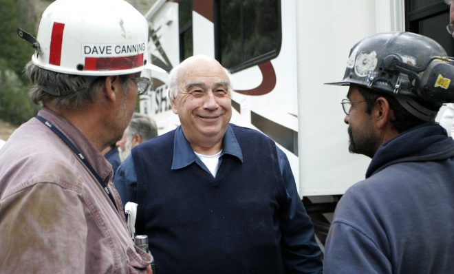 FILE PHOTO: In an Aug, 26, 2007 file photo, Robert Murray, center, chief executive of Murray Energy Corp., smiles while talking to Dave Canning, left, and Mike Glassom, right, two miners in charge of drilling bore holes into the Crandall Canyon M before a news conference northwest of Huntington, Utah. 