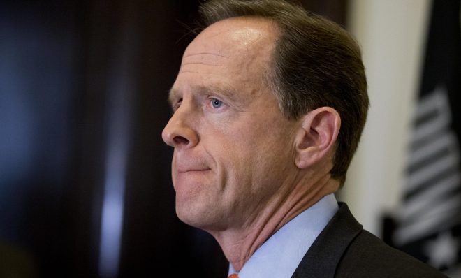 FILE PHOTO: Sen. Patrick J. Toomey, R-Pa. speaks to reporters outside his office on Capitol Hill, in Washington, Tuesday, April 12, 2016.