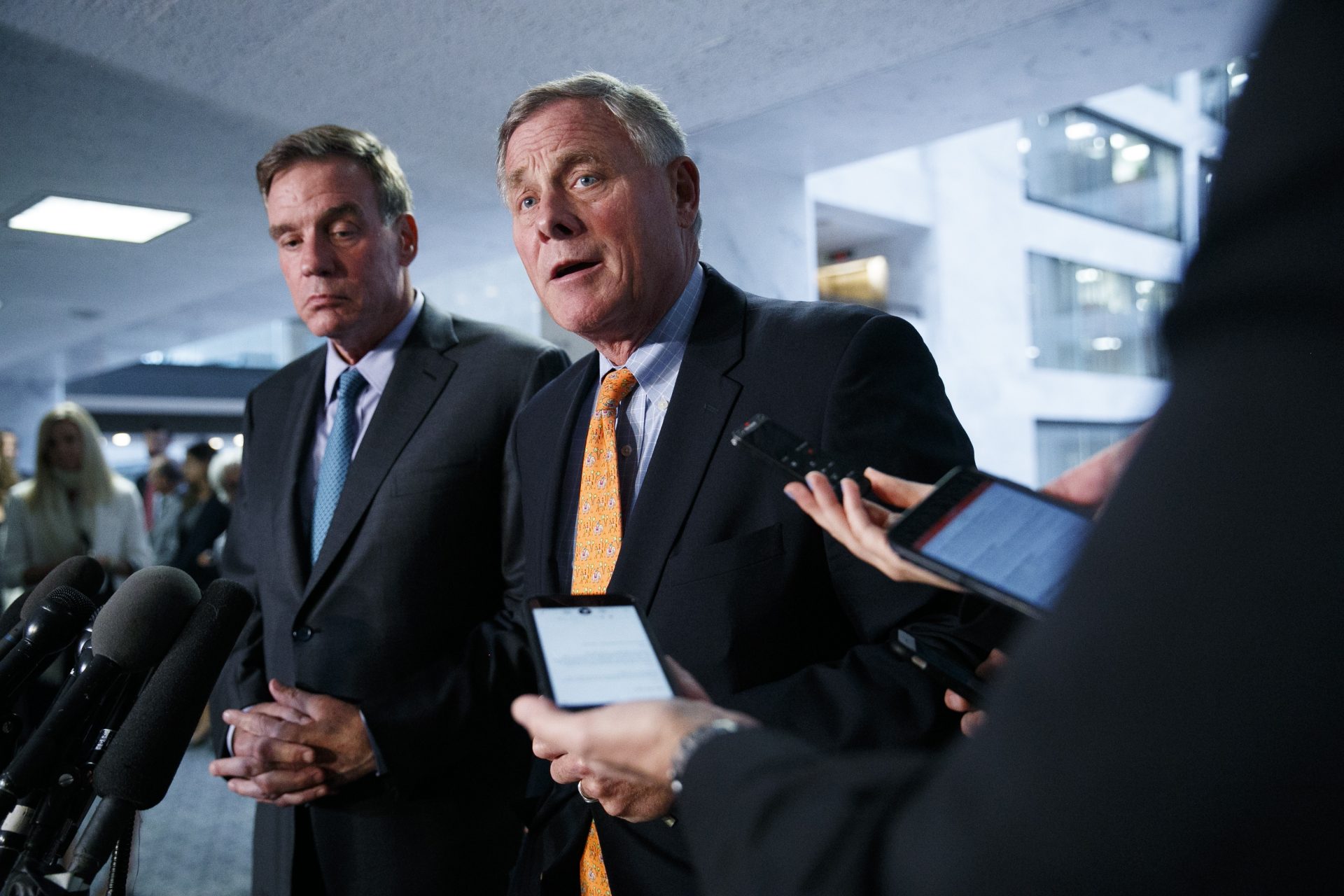Sen. Richard Burr, R-N.C., right, chairman of the Senate Intelligence Committee, and Sen. Mark Warner, D-Va., committee vice chair, speak to the media after receiving closed briefings from Acting Director of National Intelligence Joseph Maguire and national intelligence inspector general Michael Atkinson, Thursday Sept. 26, 2019, on Capitol Hill in Washington.