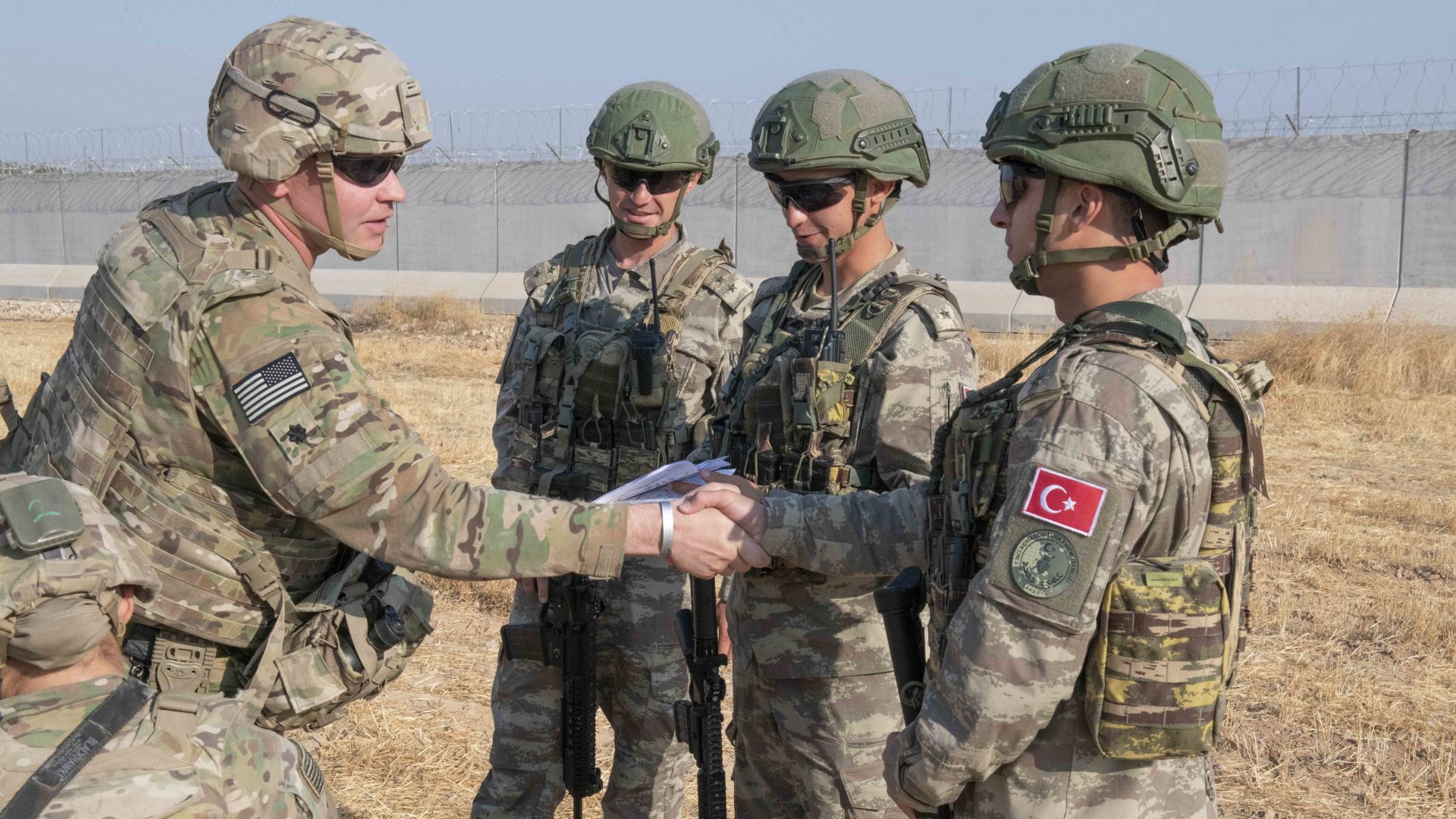 U.S. allies in the Syrian Democratic Forces say the White House's decision to pull troops from the Syria-Turkey border has left them without hope. Here, a U.S. soldier is seen during a joint patrol with Turkish troops on Friday.