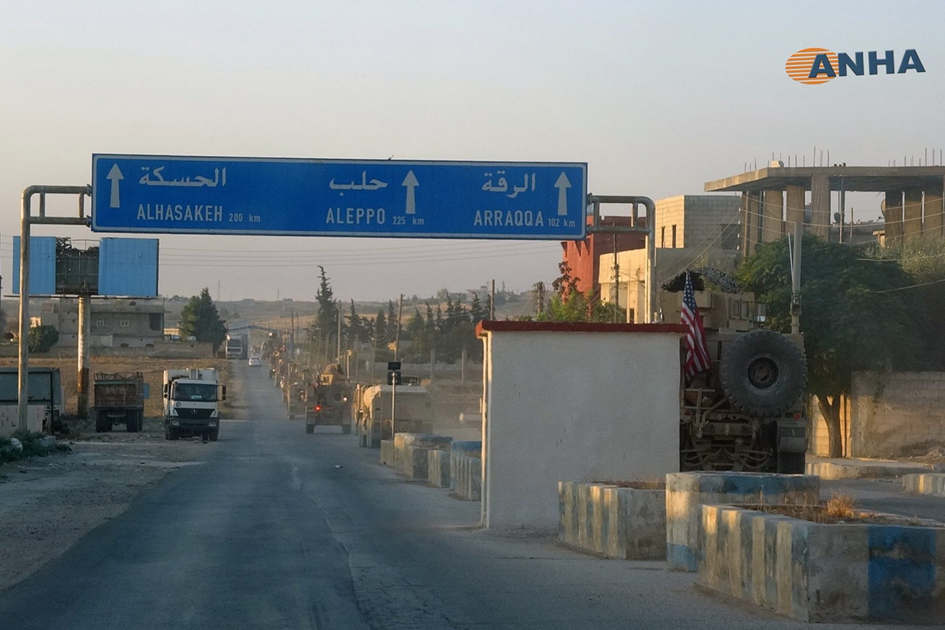 In this image provided by Hawar News Agency, ANHA, a line of U.S. military vehicles travel down a main road in northeast Syria, Monday, Oct. 7, 2019. U.S.-backed Kurdish-led forces in Syria said American troops began withdrawing Monday from their positions along Turkey's border in northeastern Syria, ahead of an anticipated Turkish invasion that the Kurds say will overturn five years of achievements in the battle against the Islamic State group.