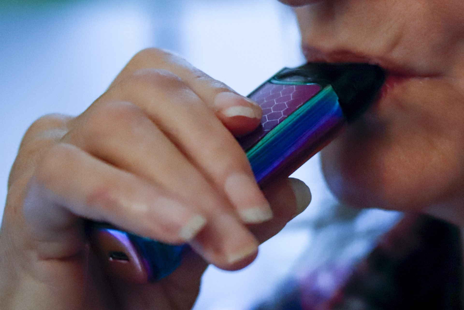In this photo made on Friday, Oct. 4, 2019, a woman uses her vaping device in Harmony, Pa.