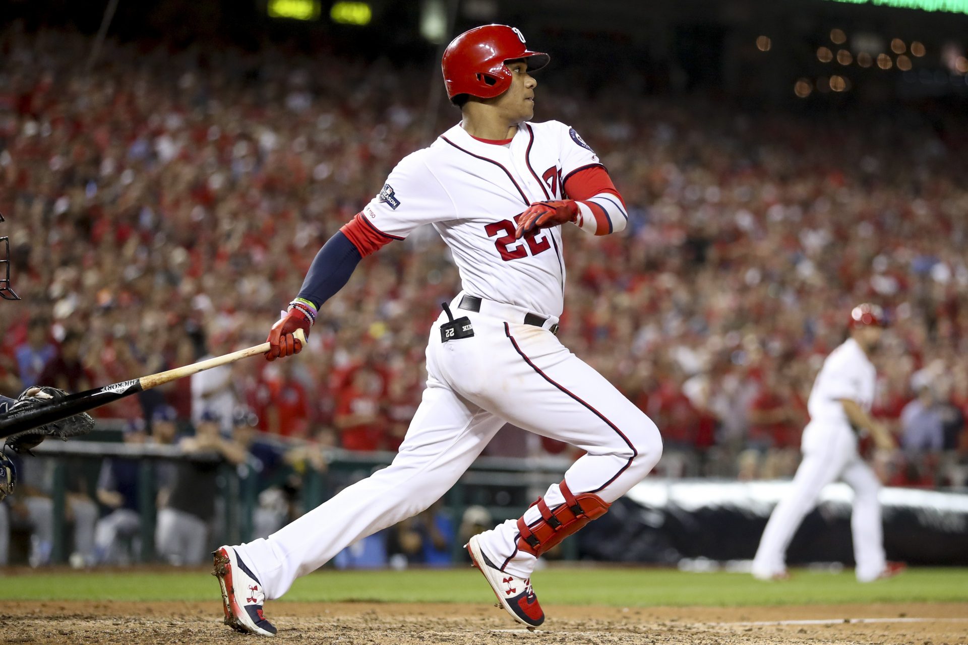 Washington Nationals' Juan Soto (22) drives in three runs with a single in the eighth inning to put the Washington Nationals up over the Milwaukee Brewers in a National League wild-card baseball game at Nationals Park, Tuesday, Oct. 1, 2019, in Washington. The Nationals won 4-3.