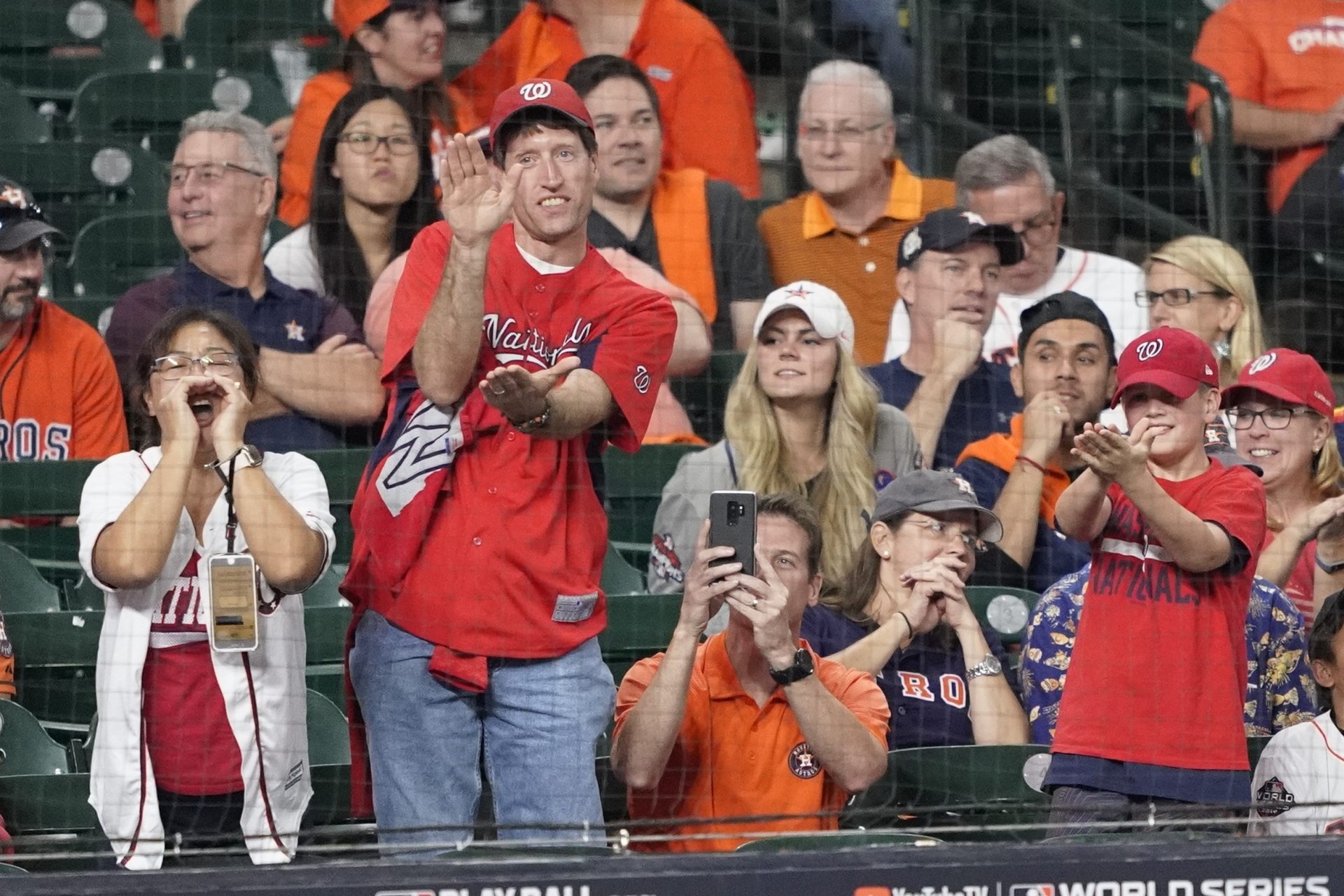 Fans gesture the baby shark as Washington Nationals' Gerardo Parra bats during the ninth inning of Game 2 of the baseball World Series against the Houston Astros Wednesday, Oct. 23, 2019, in Houston.