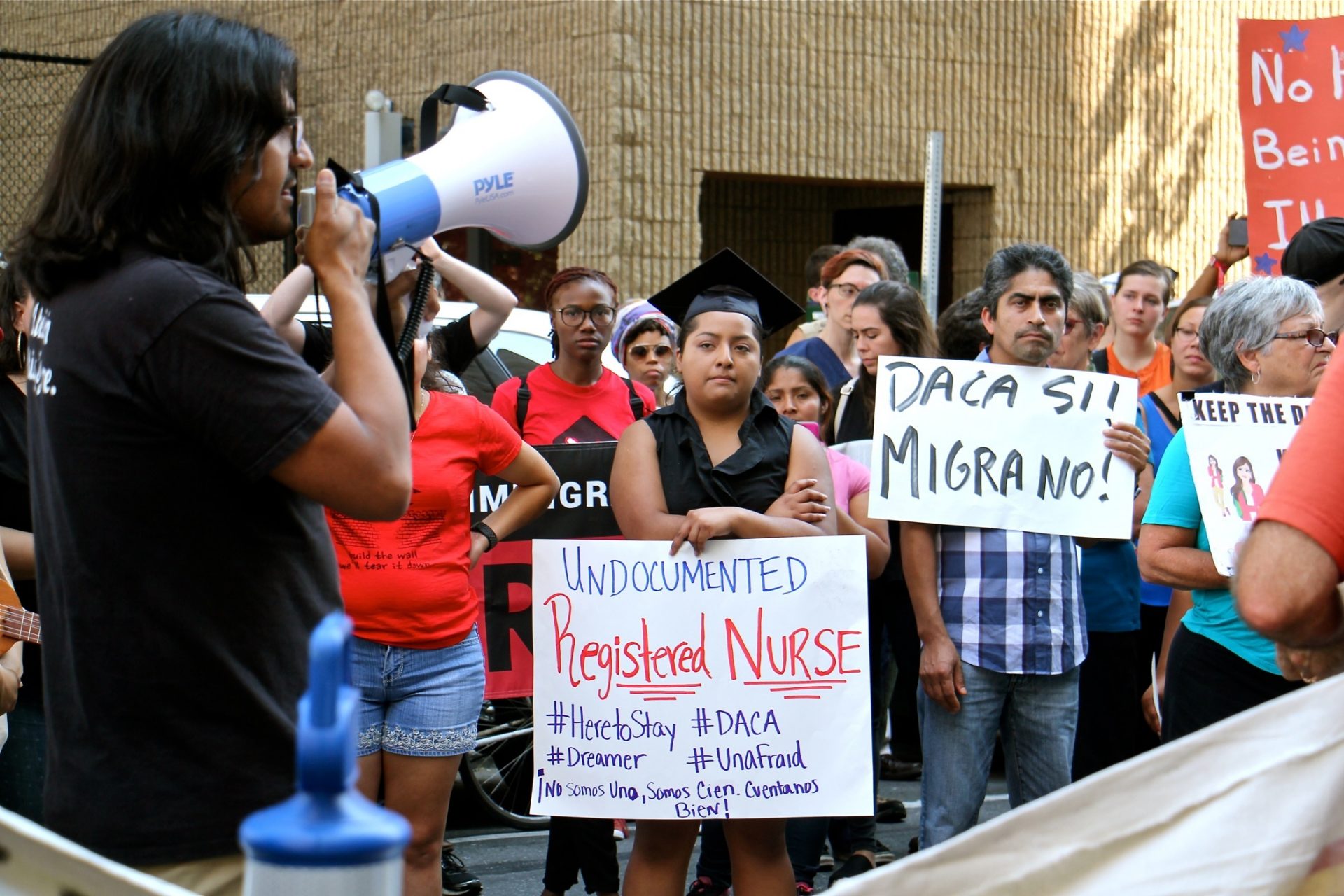 Anel Medina (center), a registered nurse who graduated from Delaware County Community College, joins a rally in support of DACA.