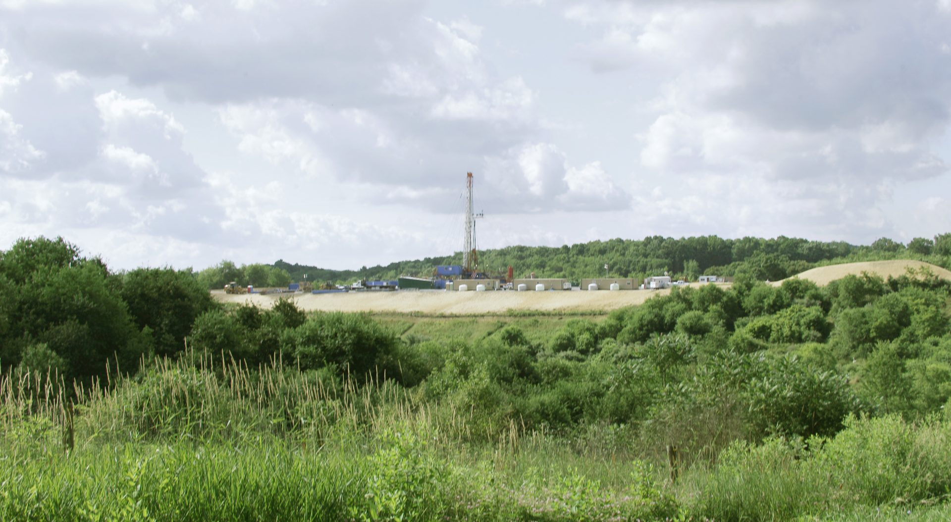 A crew works on a drilling rig at a well site for shale based natural gas on Monday, June 25, 2012 in Zelienople, Pa.
