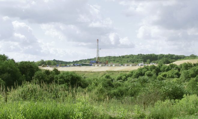 A crew works on a drilling rig at a well site for shale based natural gas on Monday, June 25, 2012 in Zelienople, Pa.