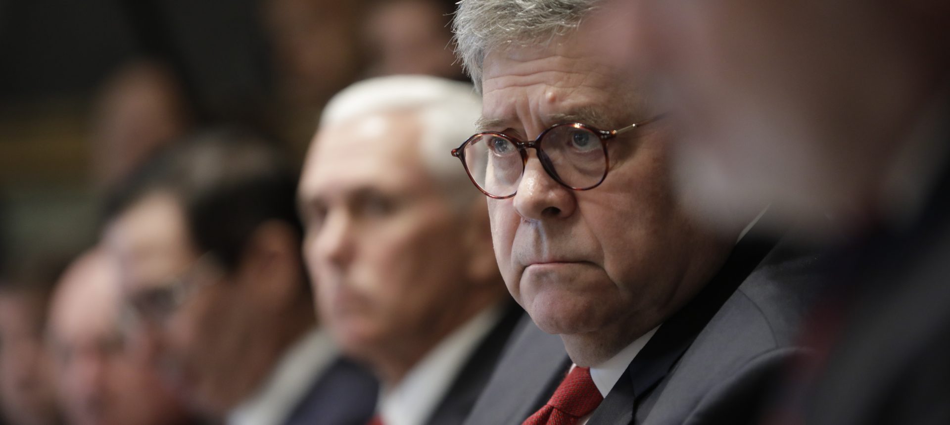 Attorney General William Barr, center, and Vice President Mike Pence, left of Barr, attend a Cabinet meeting in the Cabinet Room of the White House, Monday, Oct. 21, 2019, in Washington.
