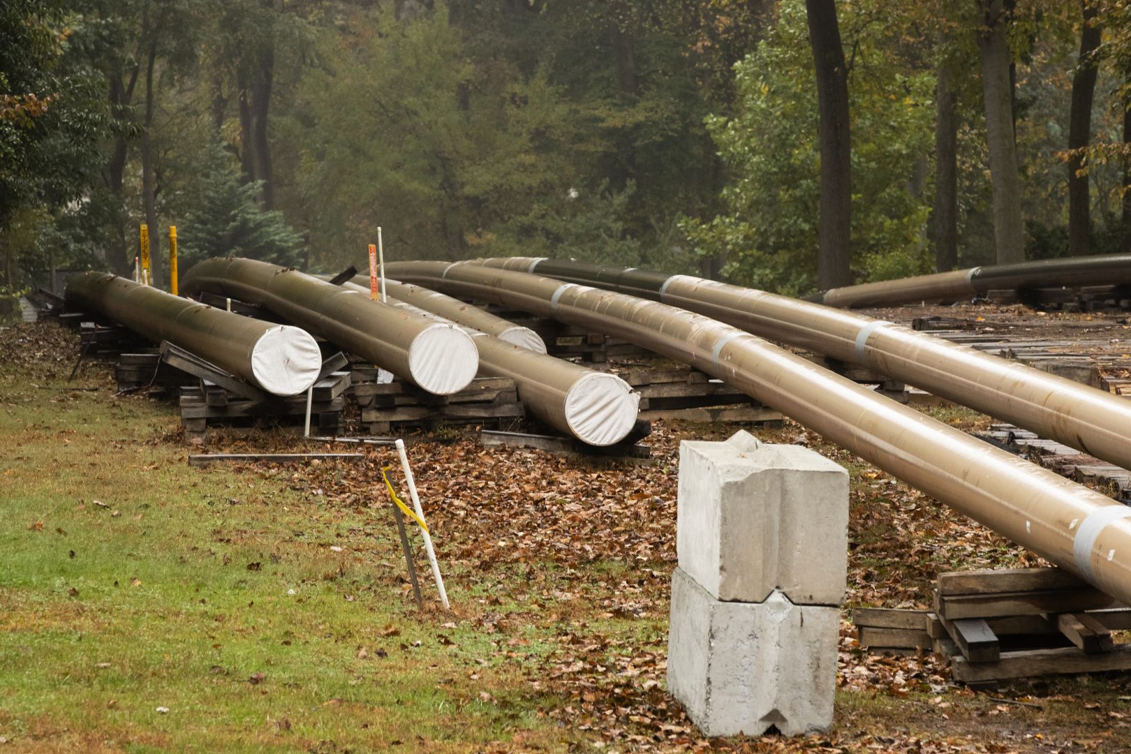 In this Tuesday, Oct. 22, 2019 photo, pipes lay along a construction site on the Mariner East pipeline in a residential neighborhood in Exton, Pa.