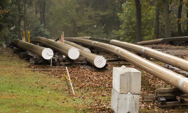 In this Tuesday, Oct. 22, 2019 photo, pipes lay along a construction site on the Mariner East pipeline in a residential neighborhood in Exton, Pa.