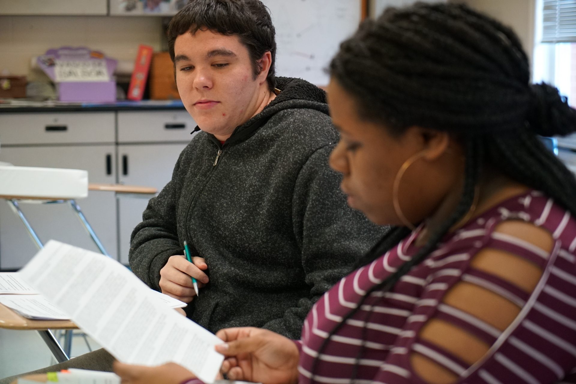 Joseph Tucker watches as Makizah Cotton makes an argument in civics class at Chatham Central High School in Bear Creek, N.C., on Tuesday, Nov. 5, 2019. The 10th-graders were debating whether President Trump should be impeached.