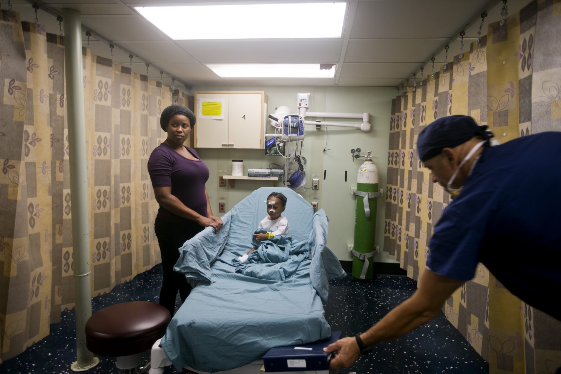 A Haitian girl gets free treatment on the U.S. Navy's hospital ship USNS Comfort anchored off Port-au-Prince, Haiti, Friday, Nov. 8, 2019. The visit of the hospital ship comes as violent demonstrations and street barricades led several hospitals across the country to run out of medical supplies.