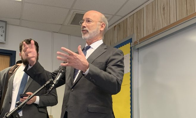 Wolf speaks to reporters after an event in Camp Hill on Nov. 13.