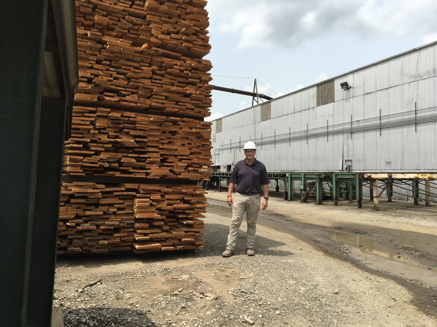 Bo Hammond is hardwood sales manager for Collins Hardwood, a company based in Oregon with locations in Pennsylvania, West Virginia and California. He and others in the industry say they're feeling the effects of the United States' trade war with China
