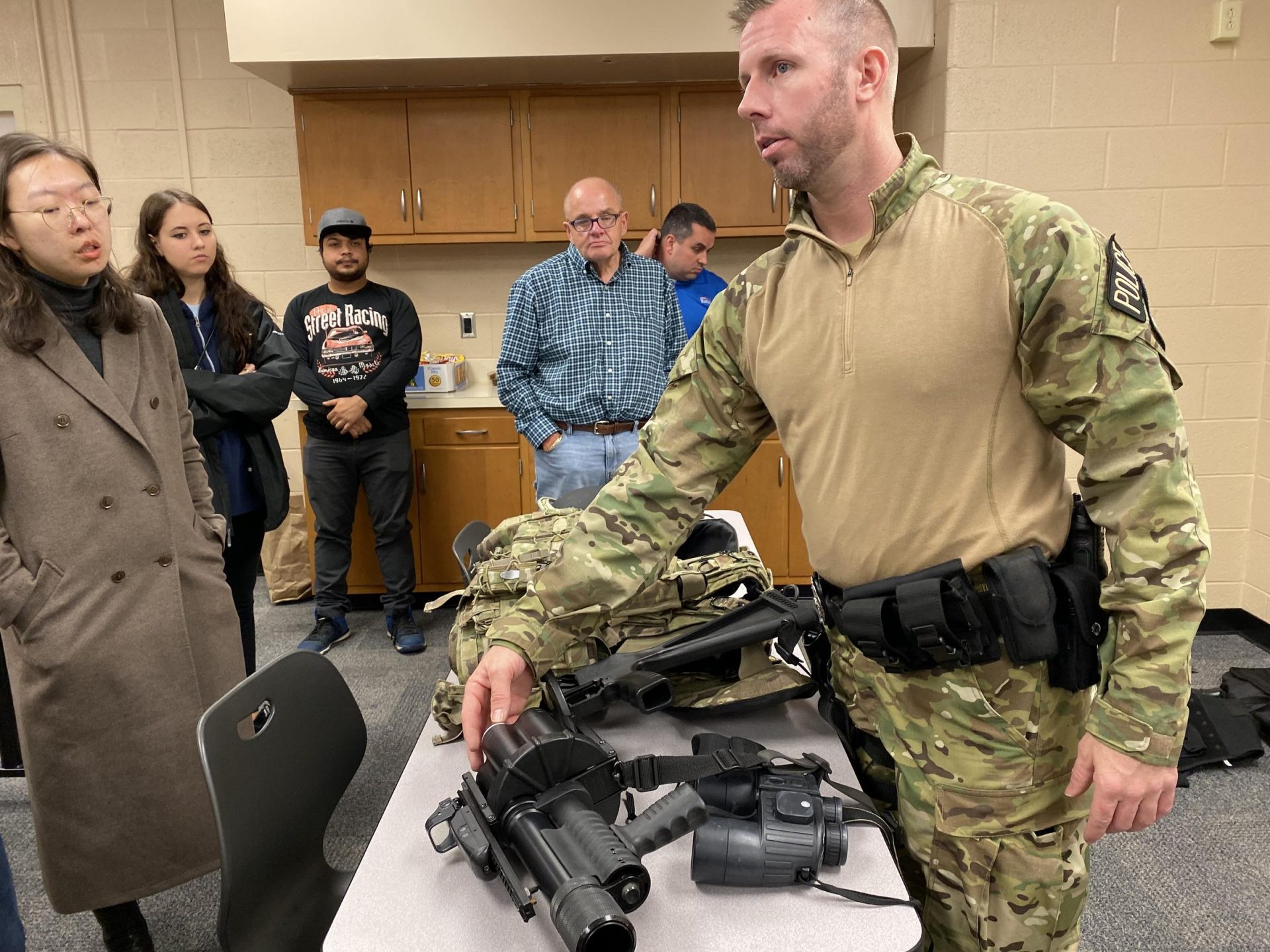 Officer Adam Salyards shows participants examples of tactical gear during the Centre County Citizens’ Police Academy.