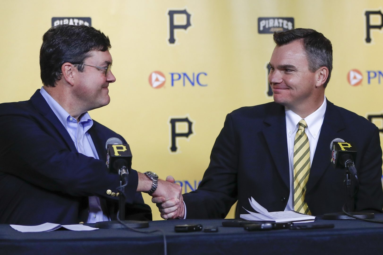 Team owner Bob Nutting, left, shakes hands with Ben Cherington during a news conference where Cherington was introduced as the new general manager of the Pittsburgh Pirates baseball team, Monday, Nov. 18, 2019, in Pittsburgh. 