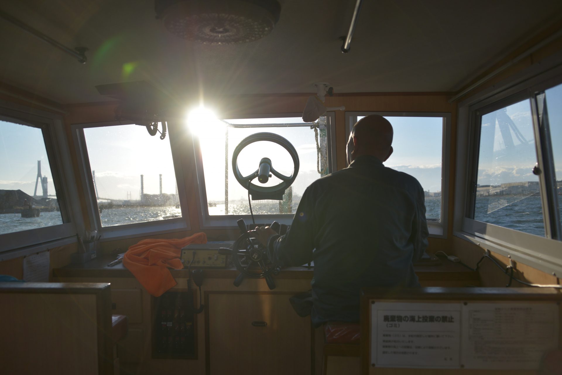 The view from a boat in Tokyo Bay frames a plant that turns liquefied natural gas back into natural gas.