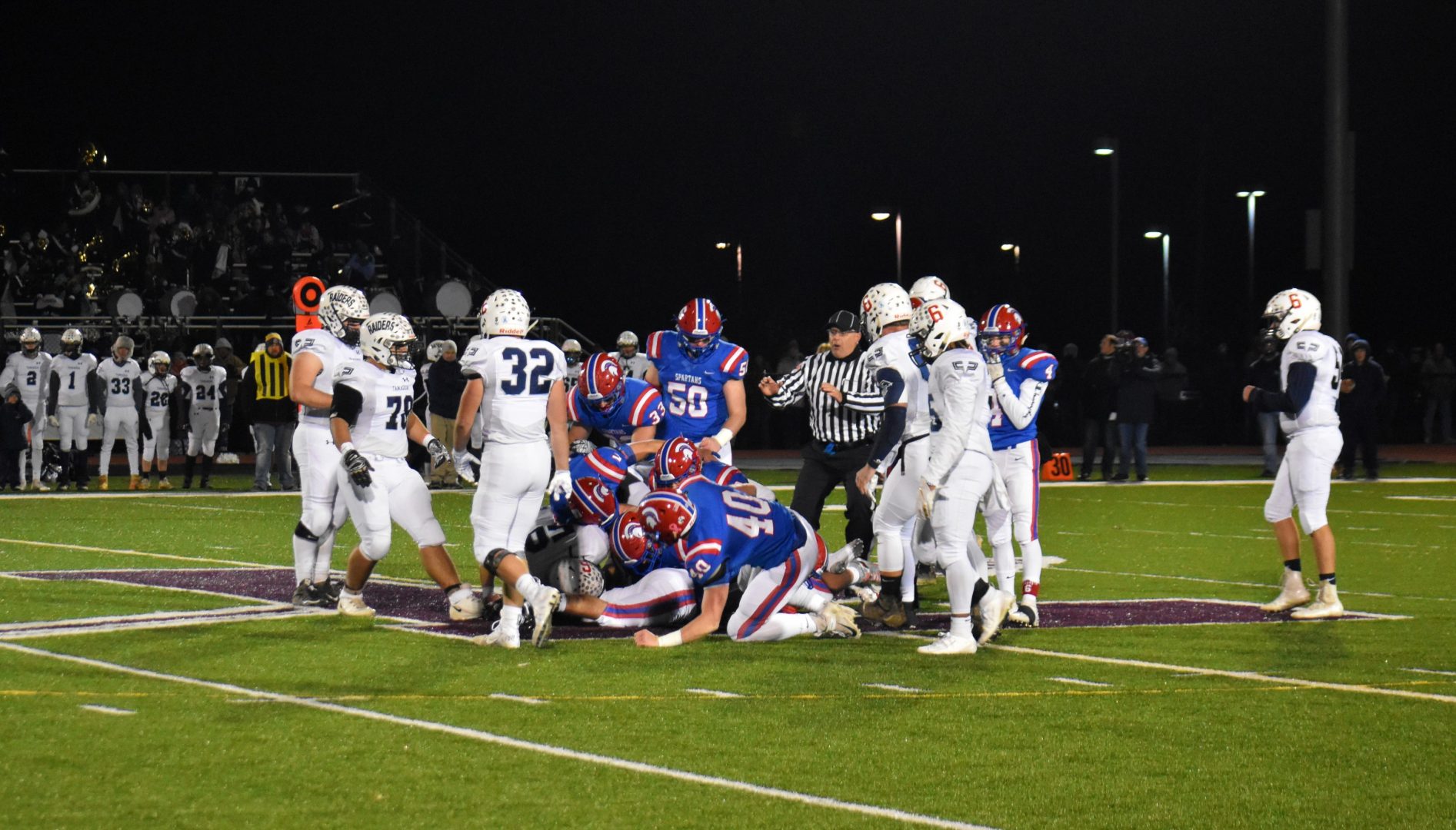 North Schuylkill Spartans and Tamaqua Blue Raiders are in a pile at the end of a play. during a Nov. 8, 2019 playoff game. 