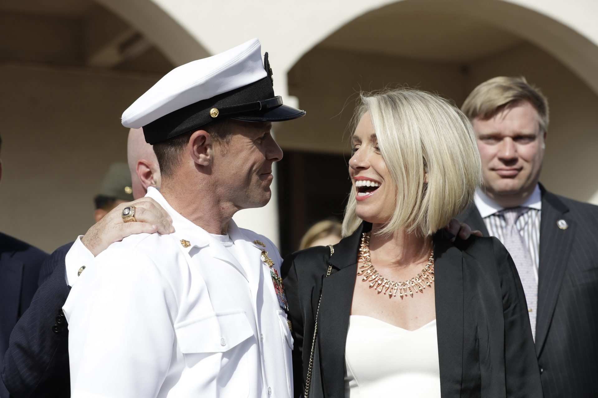 Navy Special Operations Chief Edward Gallagher, left, and his wife, Andrea Gallagher smile after leaving a military court on Naval Base San Diego, Tuesday, July 2, 2019, in San Diego. A military jury acquitted a decorated Navy SEAL of premeditated murder Tuesday in the killing of a wounded Islamic State captive under his care in Iraq in 2017.