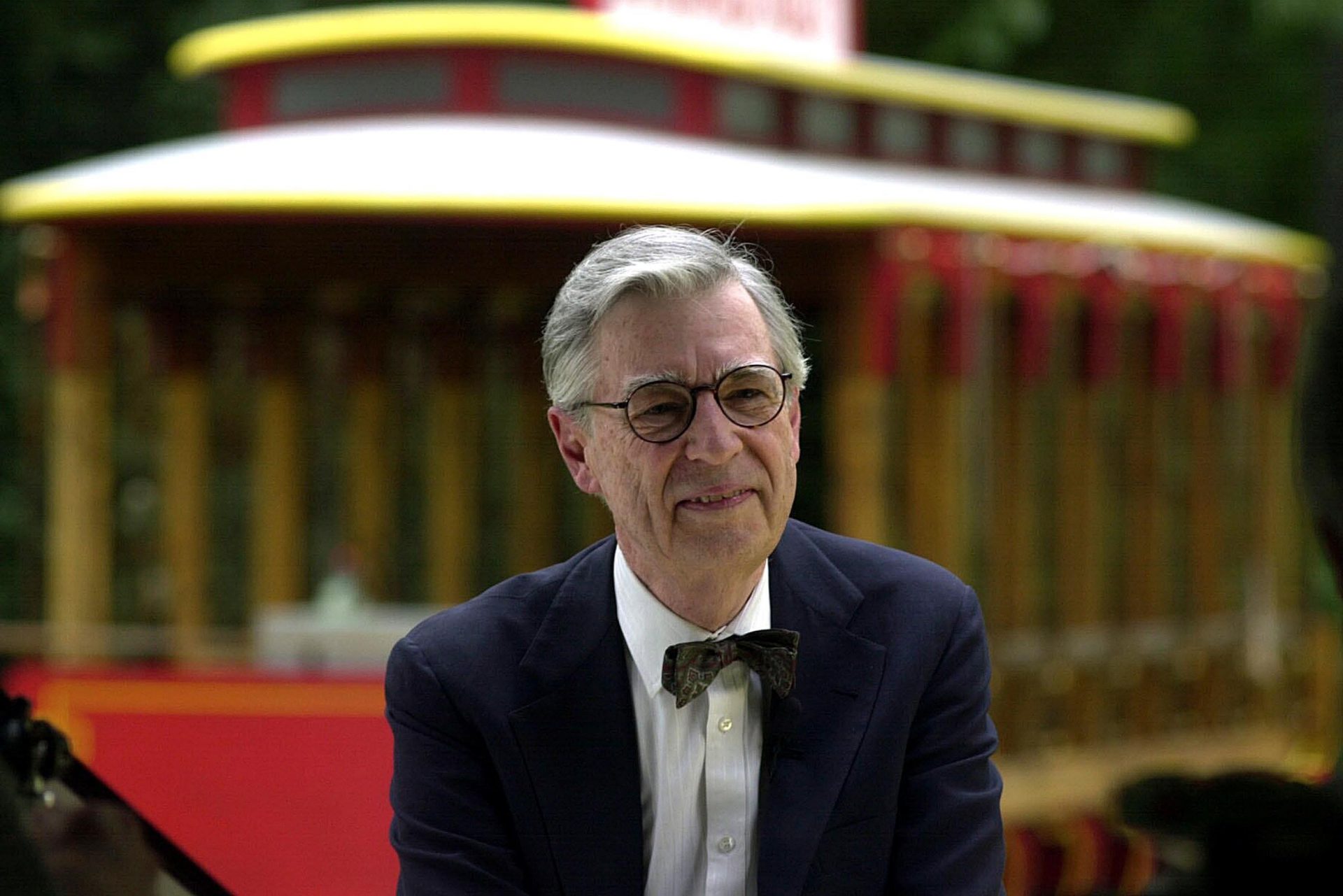 This July 12, 2000 file photo shows Fred Rogers being interviewed in front of the Mister Roger's Neighborhood Trolley attraction at Idlewild Park, in Ligonier, Pa.