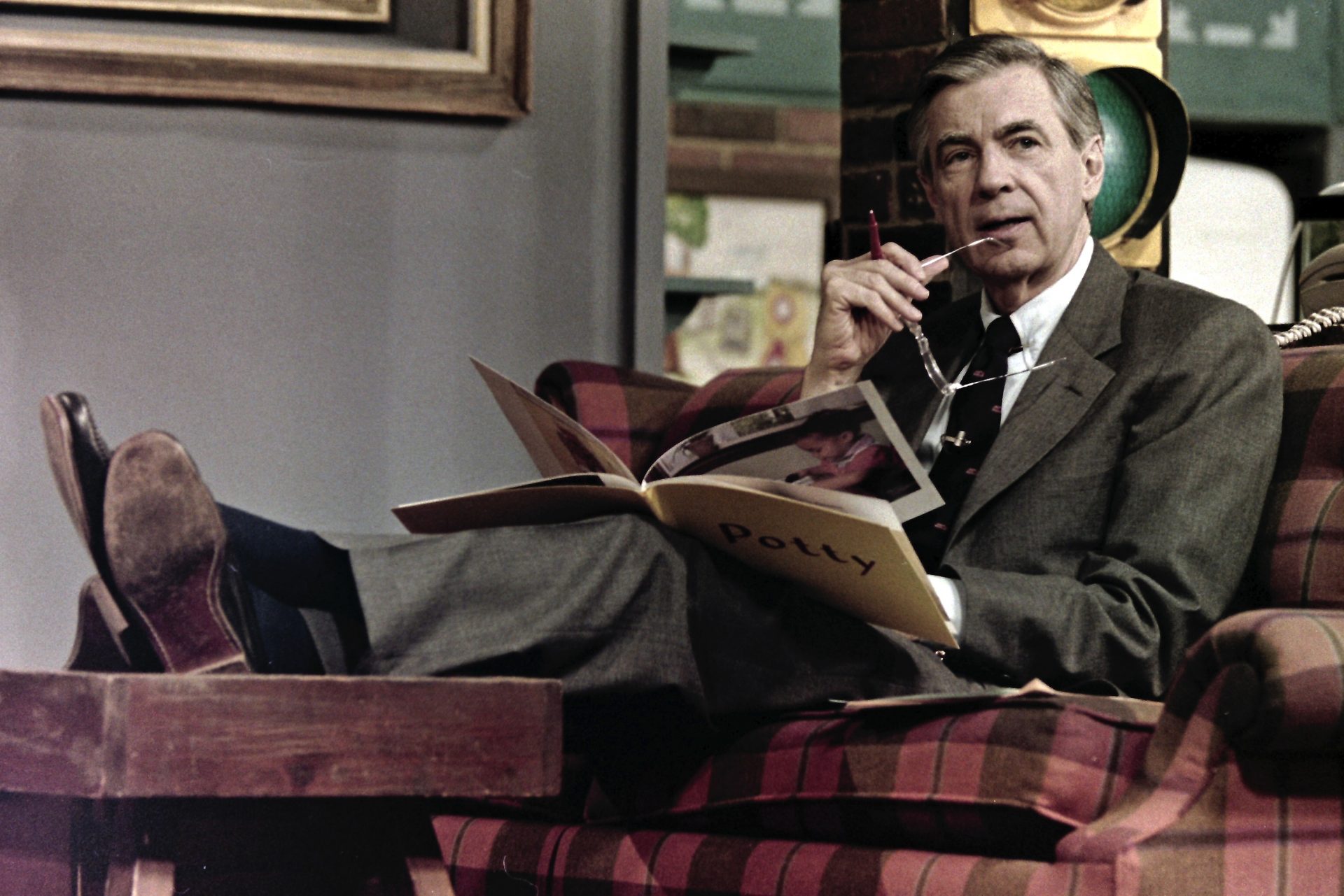 This June 28, 1989 file photo shows Fred Rogers making notes between takes on the set of his children's television program, Mister Rogers' Neighborhood, in Pittsburgh.