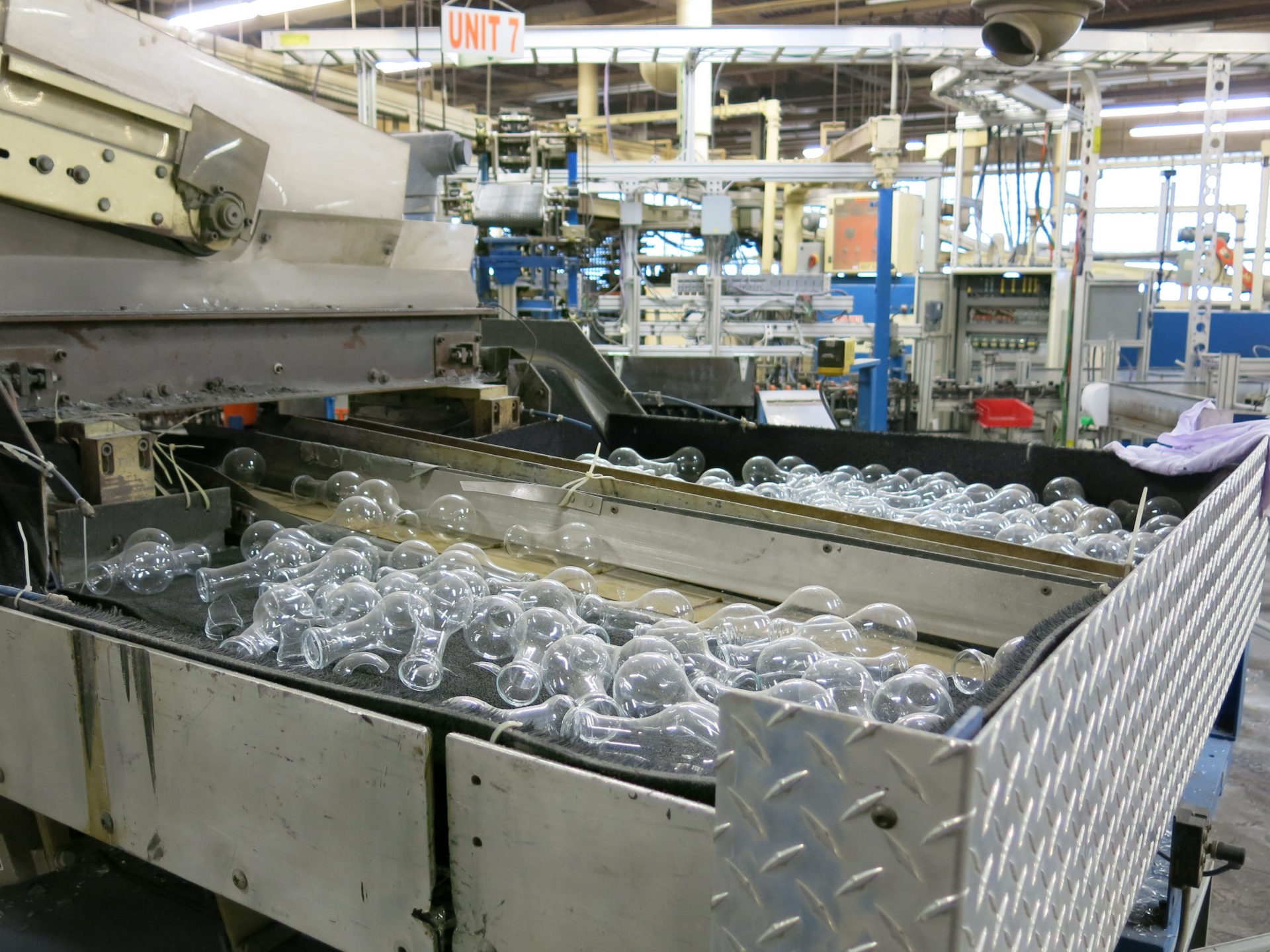 Parts of glass lightbulbs remain in the production lines. About 175 workers were affected when the plant shut down.