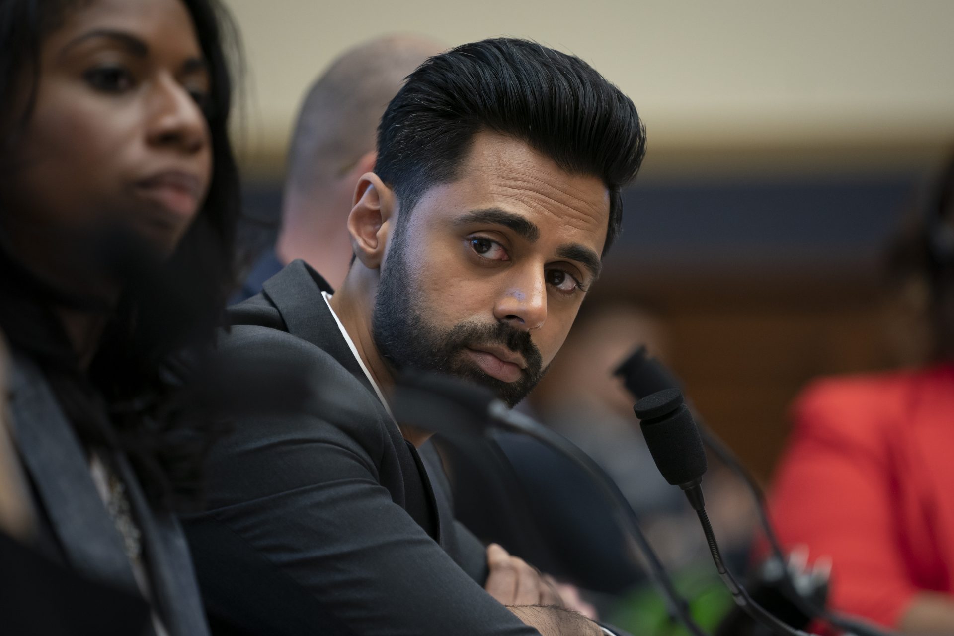 FILE PHOTO: Comedian Hasan Minhaj calls on Congress to address the student loan debt crisis as he and others testify before the House Financial Services Committee at a hearing on protecting student loan borrowers, on Capitol Hill in Washington, Tuesday, Sept. 10, 2019.