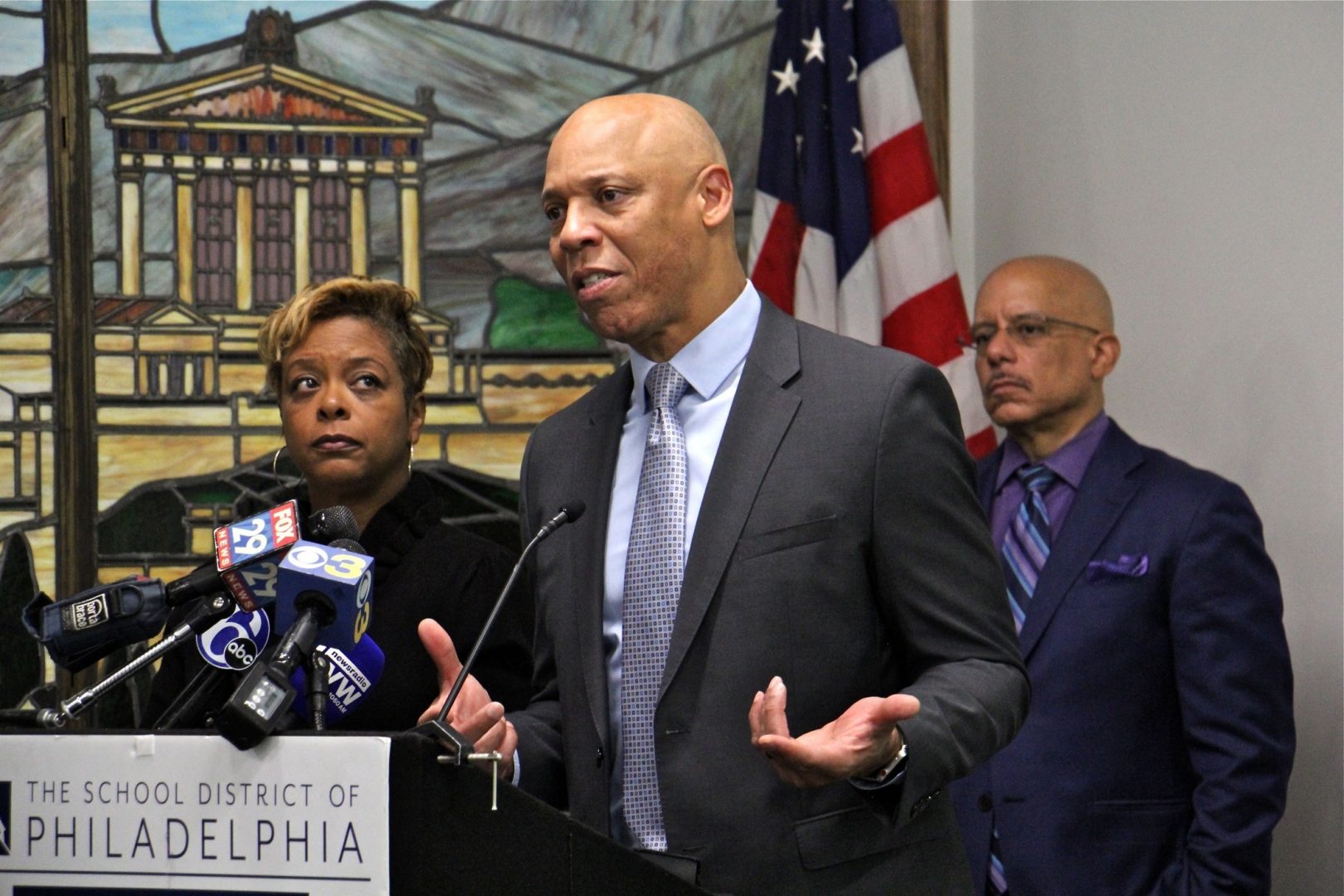 Philadelphia schools Superintendent William Hite announces the districts plan to improve environmental safety at its schools. He is joined by state Rep. Vincent Hughes (right), Councilmember Cindy Bass (left), and other local officials.