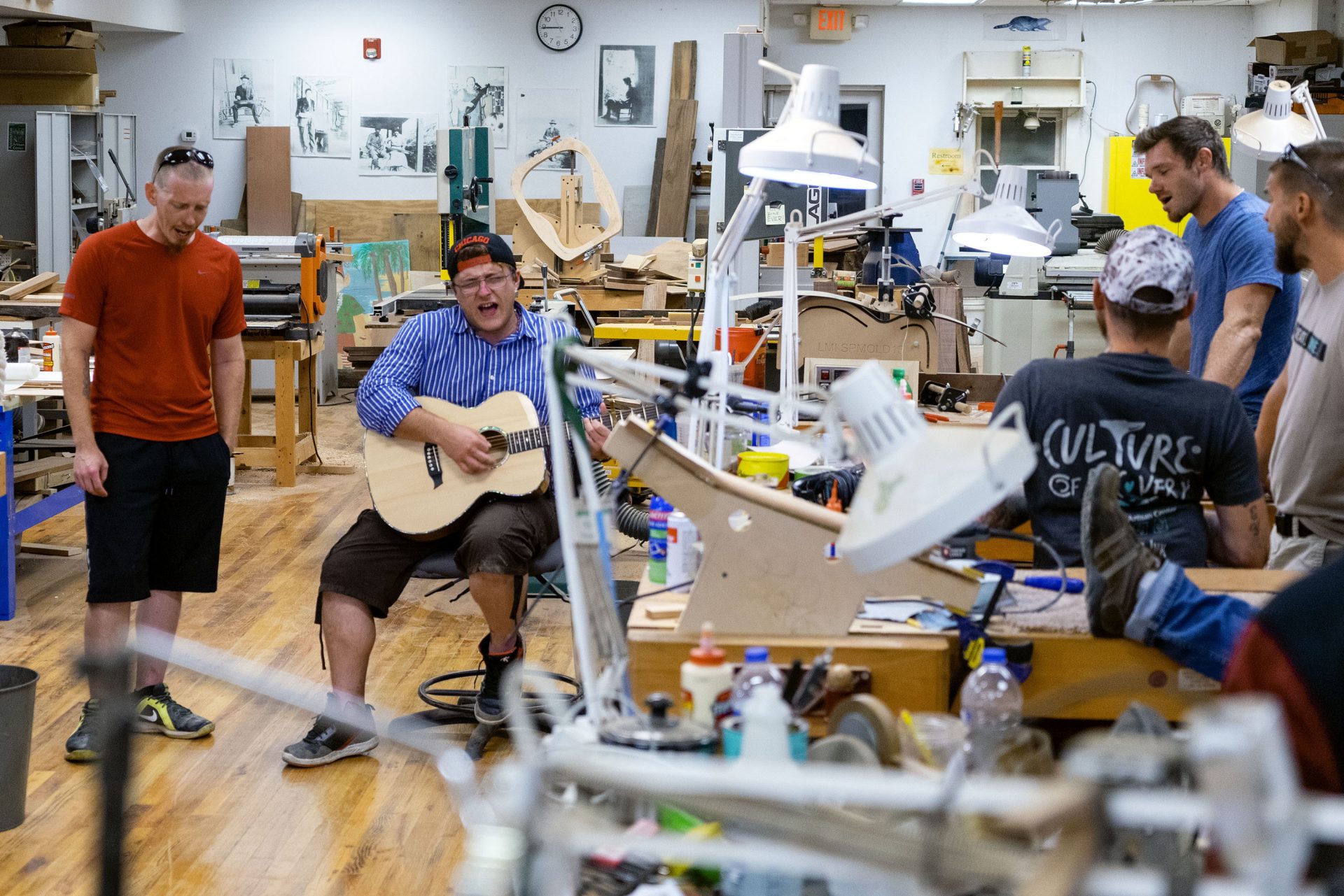 A group of guys from the local recovery center play music at the luthiery. They like to sing country singer Tyler Childers' songs together.