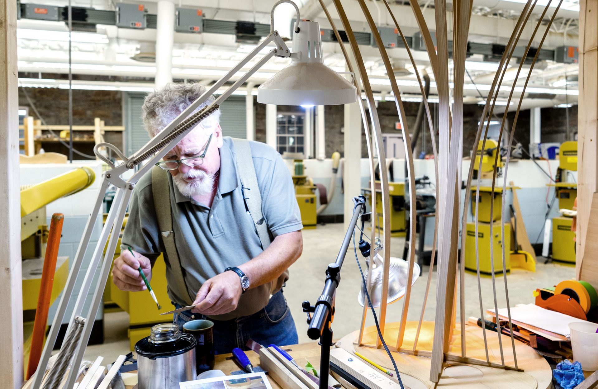 Doug Naselroad prepares glue to help build his guitar. He started the Troublesome Creek Stringed Instruments Company in May.